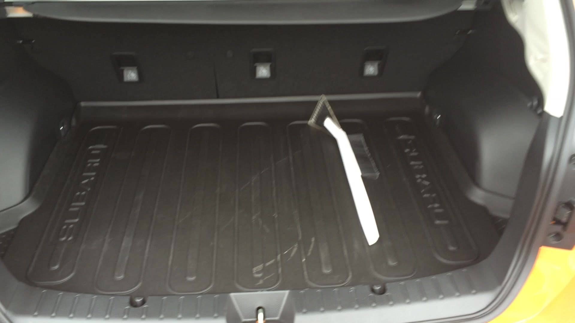 A look at the custom-fitted rubber mats in the trunk and footwell of the 2015 Subaru XV Crosstrek 2.0i Premium.