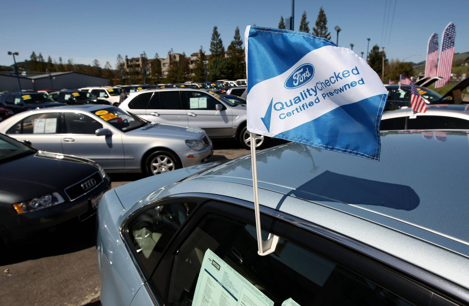 NOVATO, CA - MARCH 20: A certified pre-owned flag is seen on a used car for sale at Novato Ford March 20, 2009 in Novato, California. As the economy worsens and new car sales continue to fall, sales of used cars are up 3.1% in February compared to a year ago. (Photo by Justin Sullivan/Getty Images)