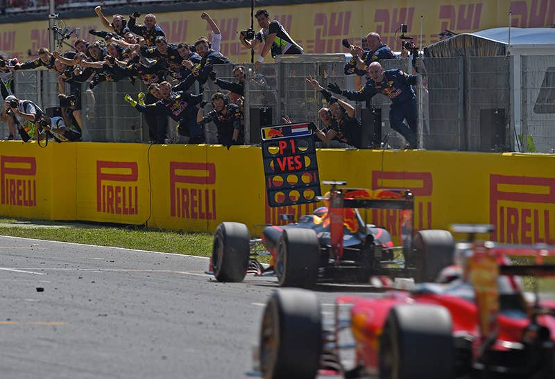 Red Bull's Belgian-Dutch driver Max Verstappen (C) wins ahead of Ferrari's Finnish driver Kimi Raikkonen at the Circuit de Catalunya on May 15, 2016 in Montmelo on the outskirts of Barcelona during the Spanish Formula One Grand Prix.