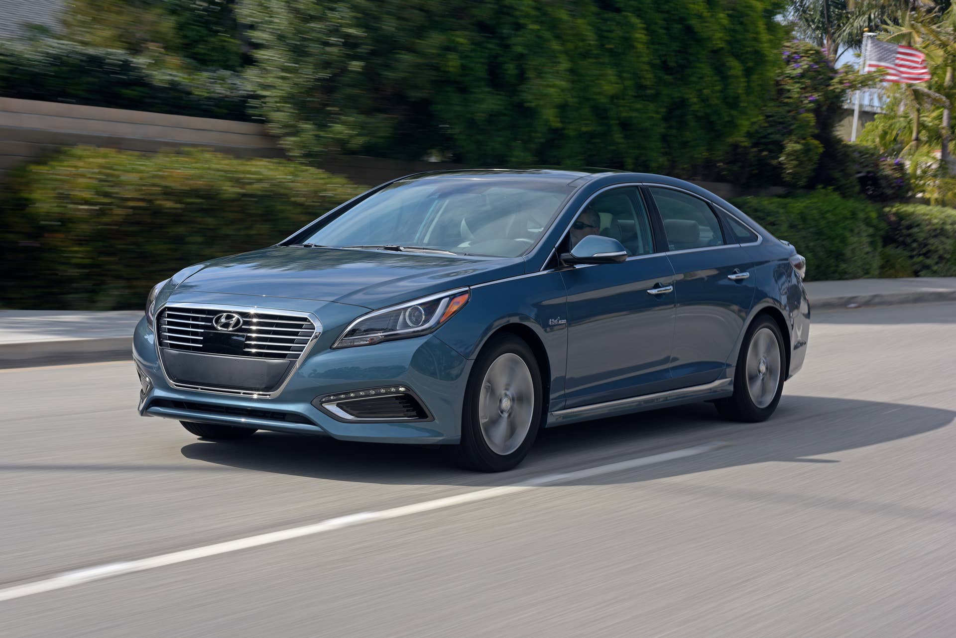 Driving shot of a blue Hyundai Sonata Sedan