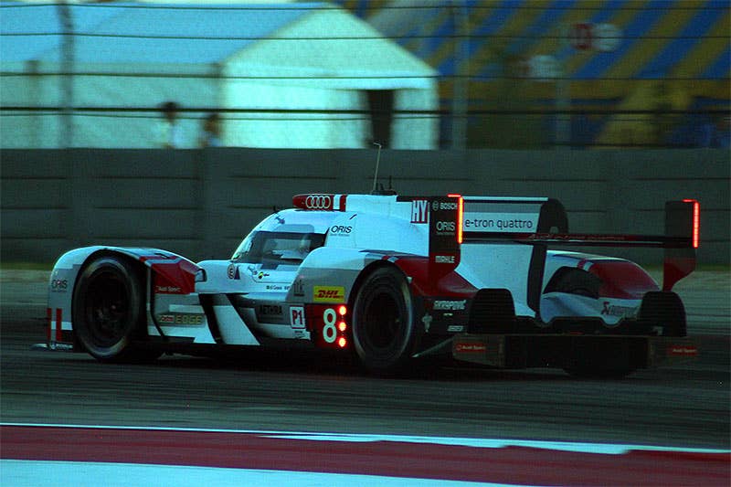 The Audi R18 E-Tron Quattro races at night at the 2015 Lone Star Le Mans.