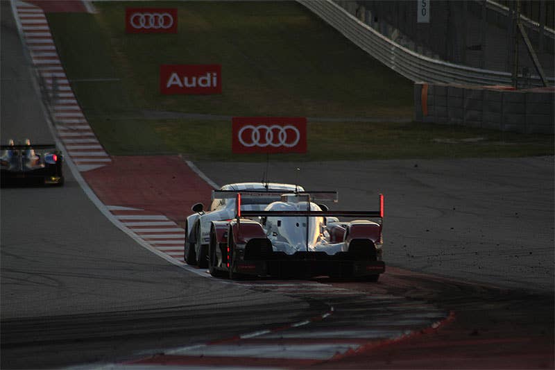The Audi R18 E-Tron Quattro races at dusk in the 2015 Lone Star Le Mans.