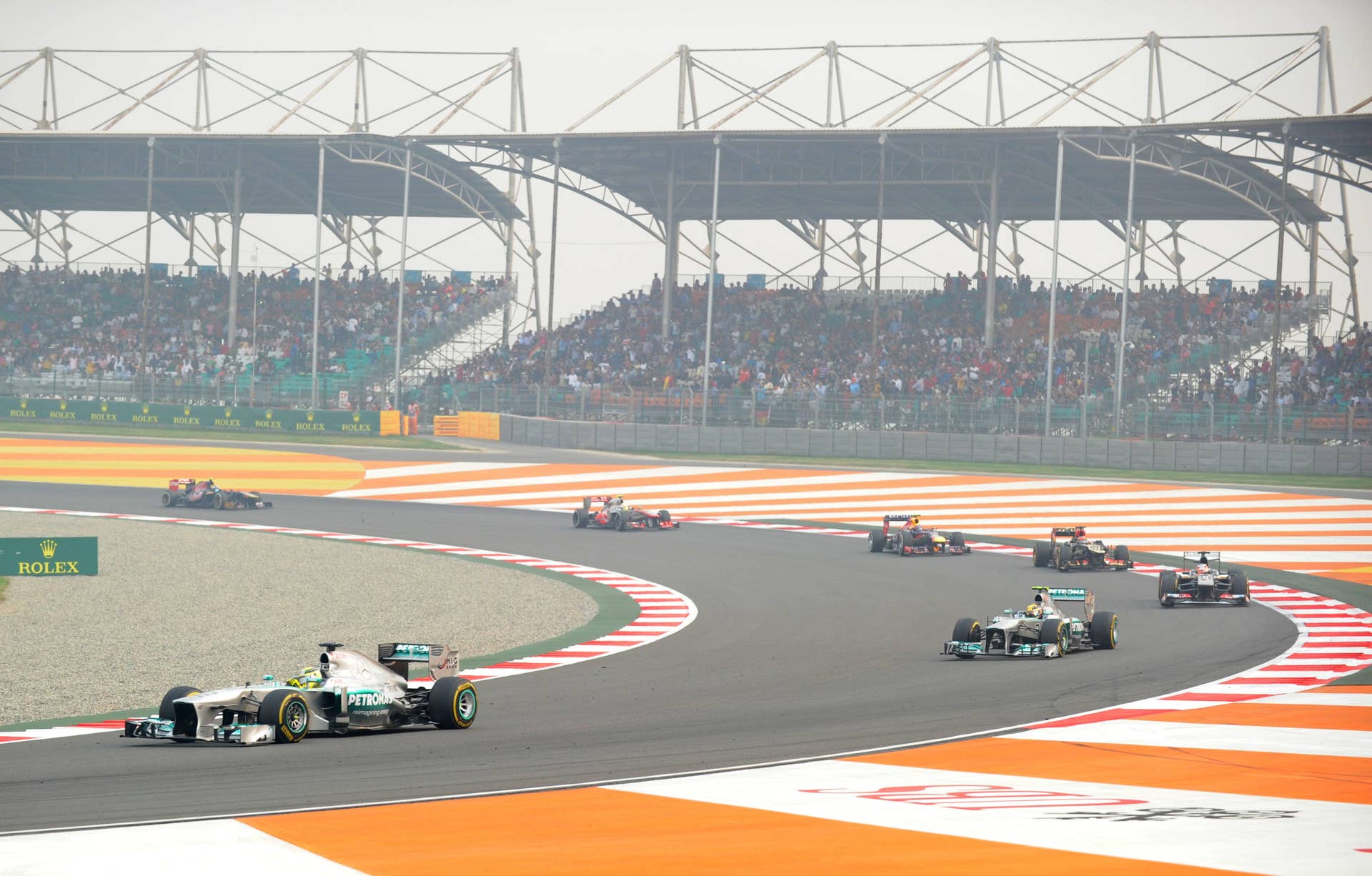 Mercedes driver Nico Rosberg (L) of Germany drives his car during the Formula One Indian Grand Prix 2013 at the Buddh International circuit in Greater Noida, on the outskirts of New Delhi on October 27, 2013.  AFP PHOTO/Prakash SINGH        (Photo credit should read PRAKASH SINGH/AFP/Getty Images)
