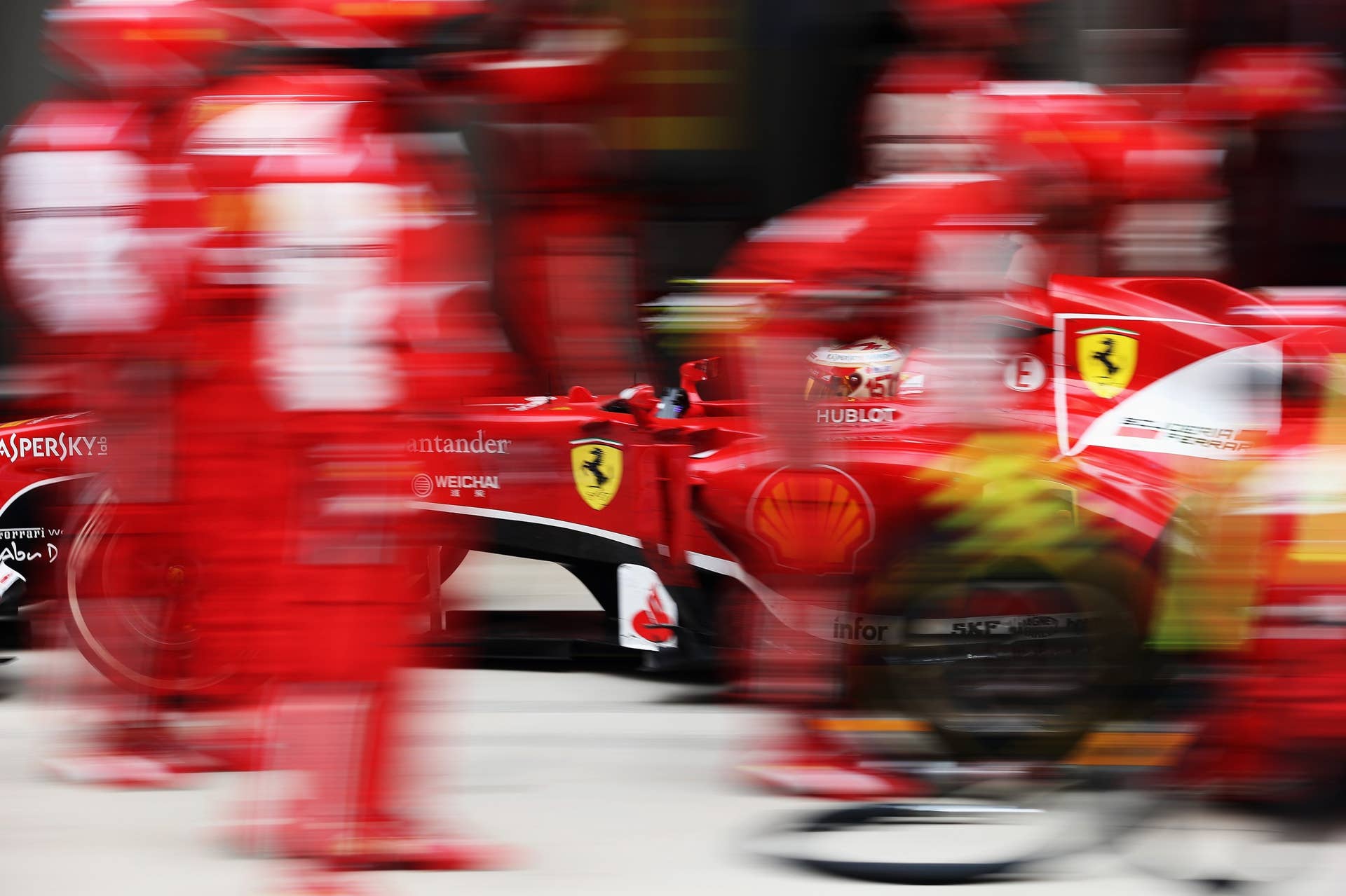 NOIDA, INDIA - OCTOBER 27:  Fernando Alonso of Spain and Ferrari drives in for a pitstop during the Indian Formula One Grand Prix at Buddh International Circuit on October 27, 2013 in Noida, India.  (Photo by Mark Thompson/Getty Images)