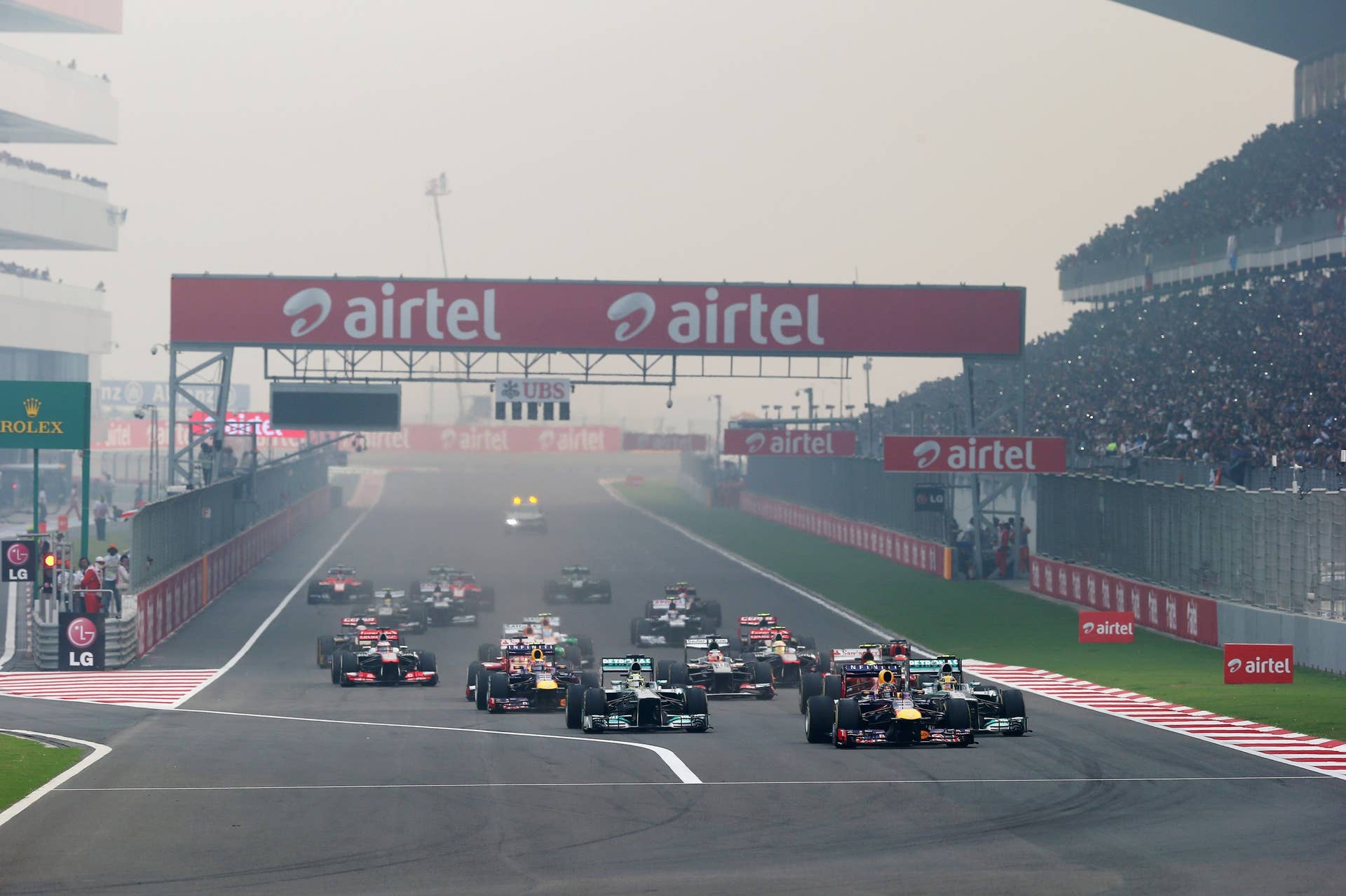 NOIDA, INDIA - OCTOBER 27:  Sebastian Vettel of Germany and Infiniti Red Bull Racing leads the field into the first corner at the start of the Indian Formula One Grand Prix at Buddh International Circuit on October 27, 2013 in Noida, India.  (Photo by Mark Thompson/Getty Images)