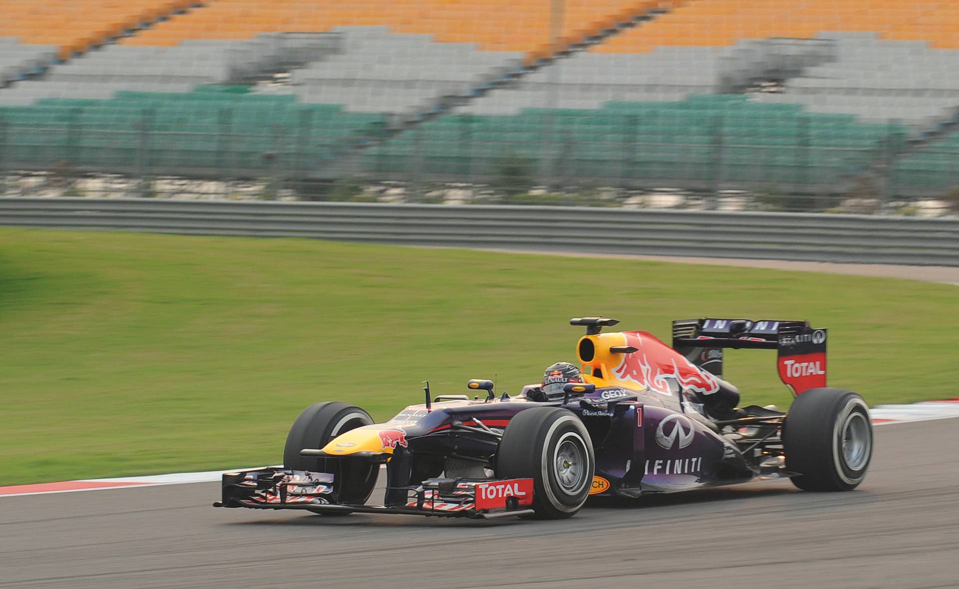Red Bull driver Sebastian Vettel of Germany drives his car during the Formula One Indian Grand Prix 2013 at the Buddh International circuit in Greater Noida on the outskirts of New Delhi October 27, 2013. AFP PHOTO/Prakash SINGH        (Photo credit should read PRAKASH SINGH/AFP/Getty Images)