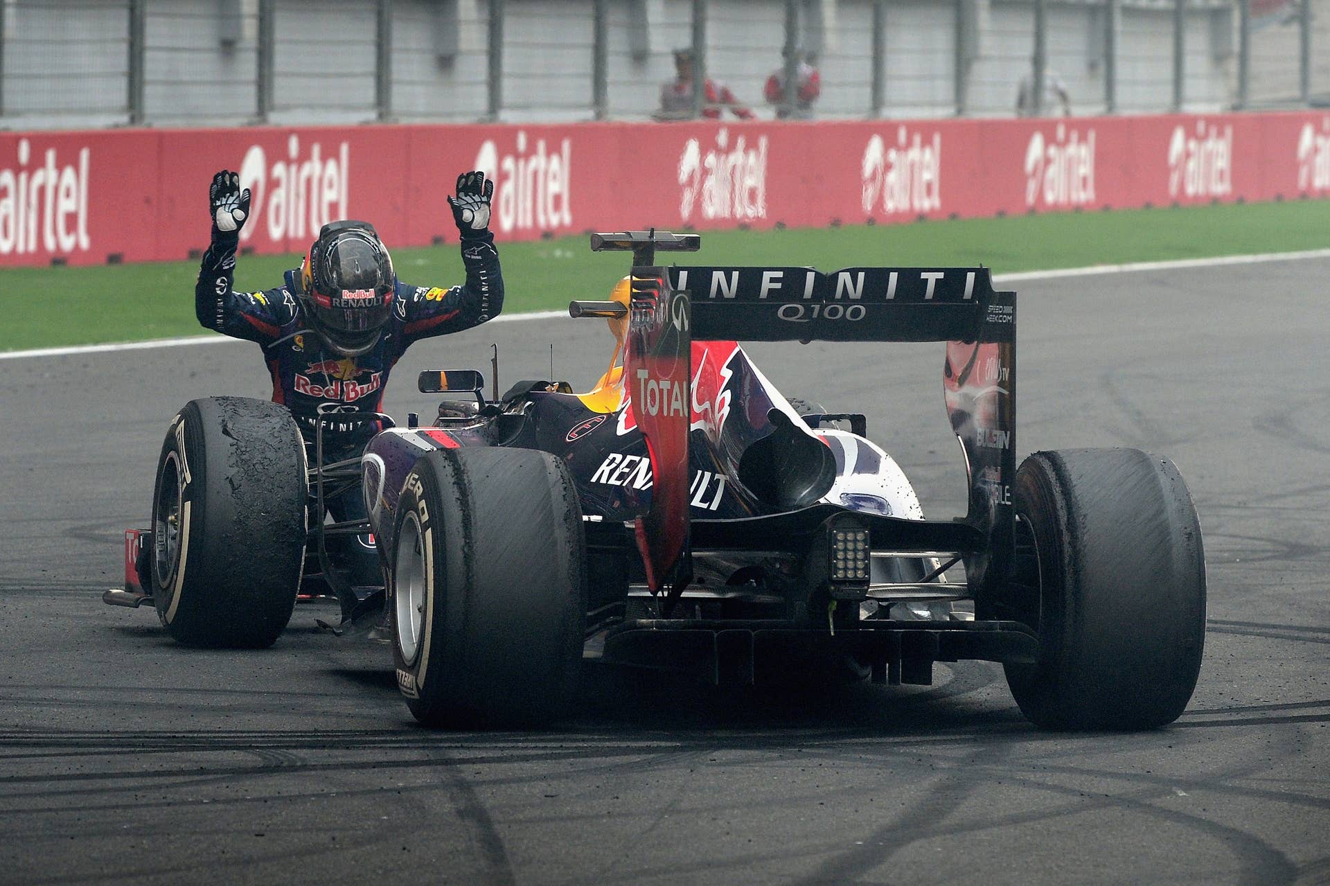 NOIDA, INDIA - OCTOBER 27:  Race winner and 2013 Formula One World Champion Sebastian Vettel of Germany and Infiniti Red Bull Racing celebrates in front of the crowd on the main straight following the Indian Formula One Grand Prix at Buddh International Circuit on October 27, 2013 in Noida, India.  (Photo by Getty Images/Getty Images)