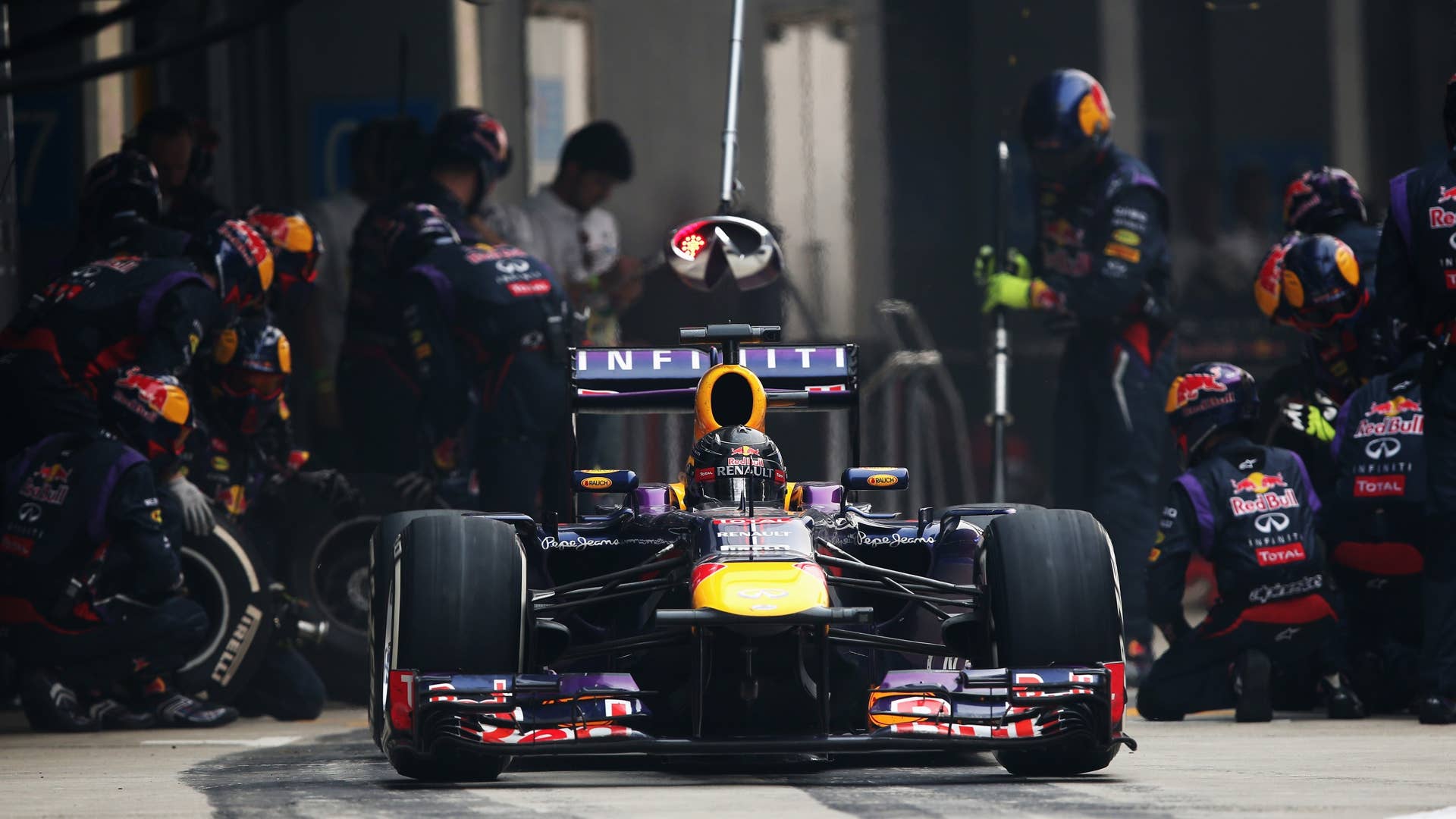 NOIDA, INDIA - OCTOBER 27:  Sebastian Vettel of Germany and Infiniti Red Bull Racing drives in for a pitstop during the Indian Formula One Grand Prix at Buddh International Circuit on October 27, 2013 in Noida, India.  (Photo by Mark Thompson/Getty Images)