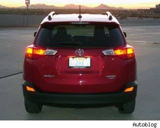 Michael: I don't love the new design. The new grille is awkward and the rear spoiler and bulbous taillights feel out of place, not "sporty" or "athletic." I think that, in time, I may come around, but, in spite of opinions on design being completely subjective, put the RAV4 next to the new Santa Fe Sport and Escape right now and there's no question who comes in third in that beauty contest.  Autoblog: The five seats can be covered in two fabric types or a synthetic leather substitute that Toyota calls Softex. After sampling all options, we definitely prefer the cloth – we find it hard to believe anyone will be fooled by the imitation leather. Sadly, opting for Limited trim necessitates the Softex interior treatment.  Toyota wanted to"add to the RAV4's sportiness" by making a "driver-centric seating area." We're not so sure it was successful – though all the switchgear, LCD screens and driver touch points are within easy reach, there doesn't seem to be any specific sportiness to the overall look and feel of the cockpit.  Research the Toyota RAV4 Toyota RAV4 Photos & Information Toyota RAV4 Best Deals Toyota RAV4 Local Dealer Price Quote