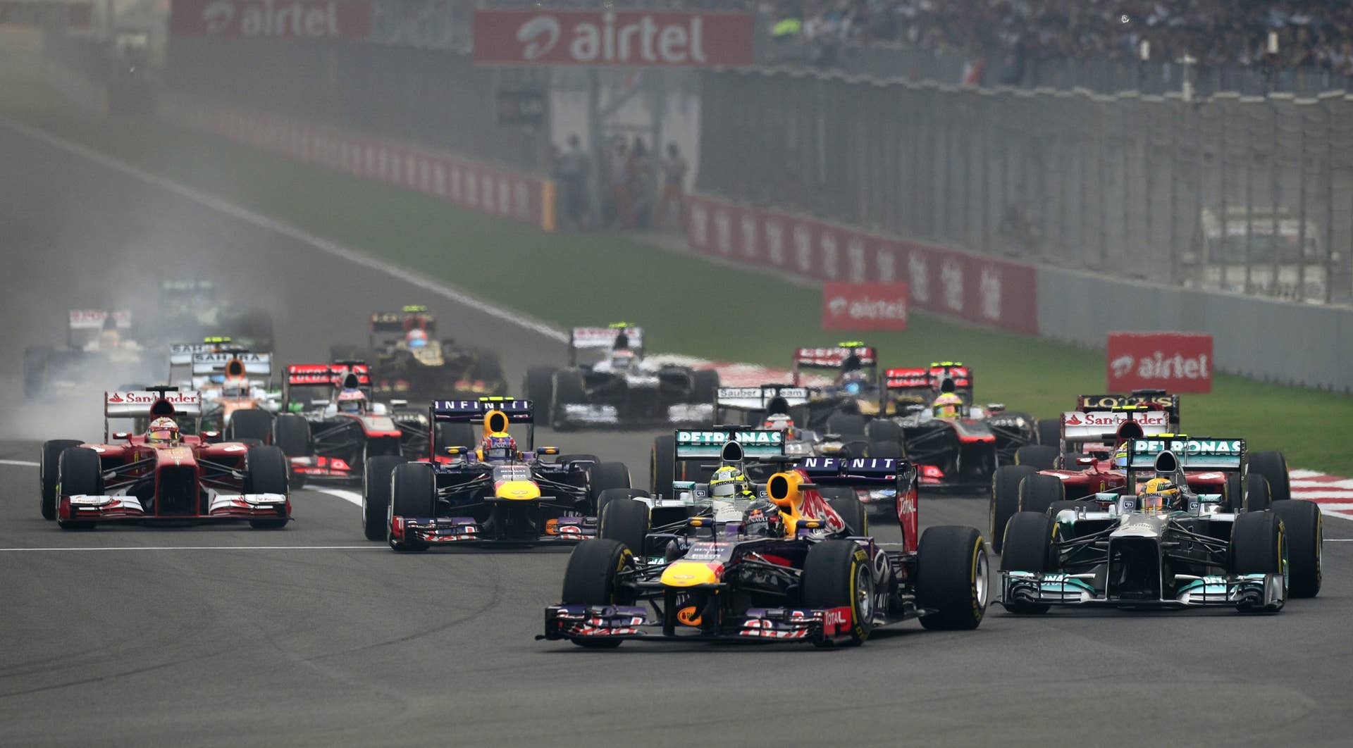 Red Bull driver Sebastian Vettel  of Germany leads the pack during the Formula One Indian Grand Prix 2013 at the Buddh International circuit in Greater Noida, on the outskirts of New Delhi on October 27, 2013.  AFP PHOTO/MANAN VATSYAYANA        (Photo credit should read MANAN VATSYAYANA/AFP/Getty Images)