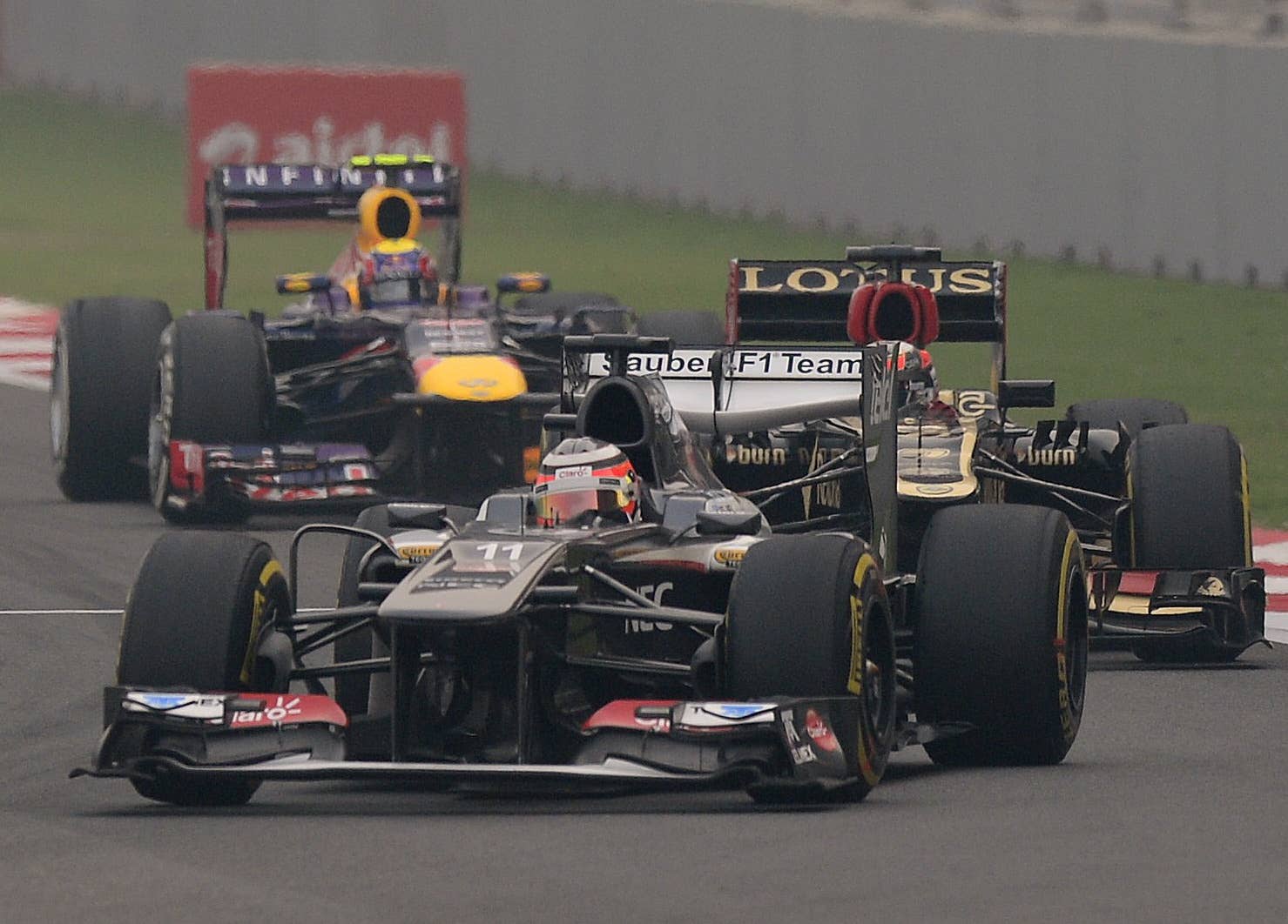 Sauber driver Nico Hulkenberg (front) of Germany drives his car during the Formula One Indian Grand Prix 2013 at the Buddh International circuit in Greater Noida, on the outskirts of New Delhi on October 27, 2013.  AFP PHOTO/ MANAN VATSYAYANA        (Photo credit should read MANAN VATSYAYANA/AFP/Getty Images)