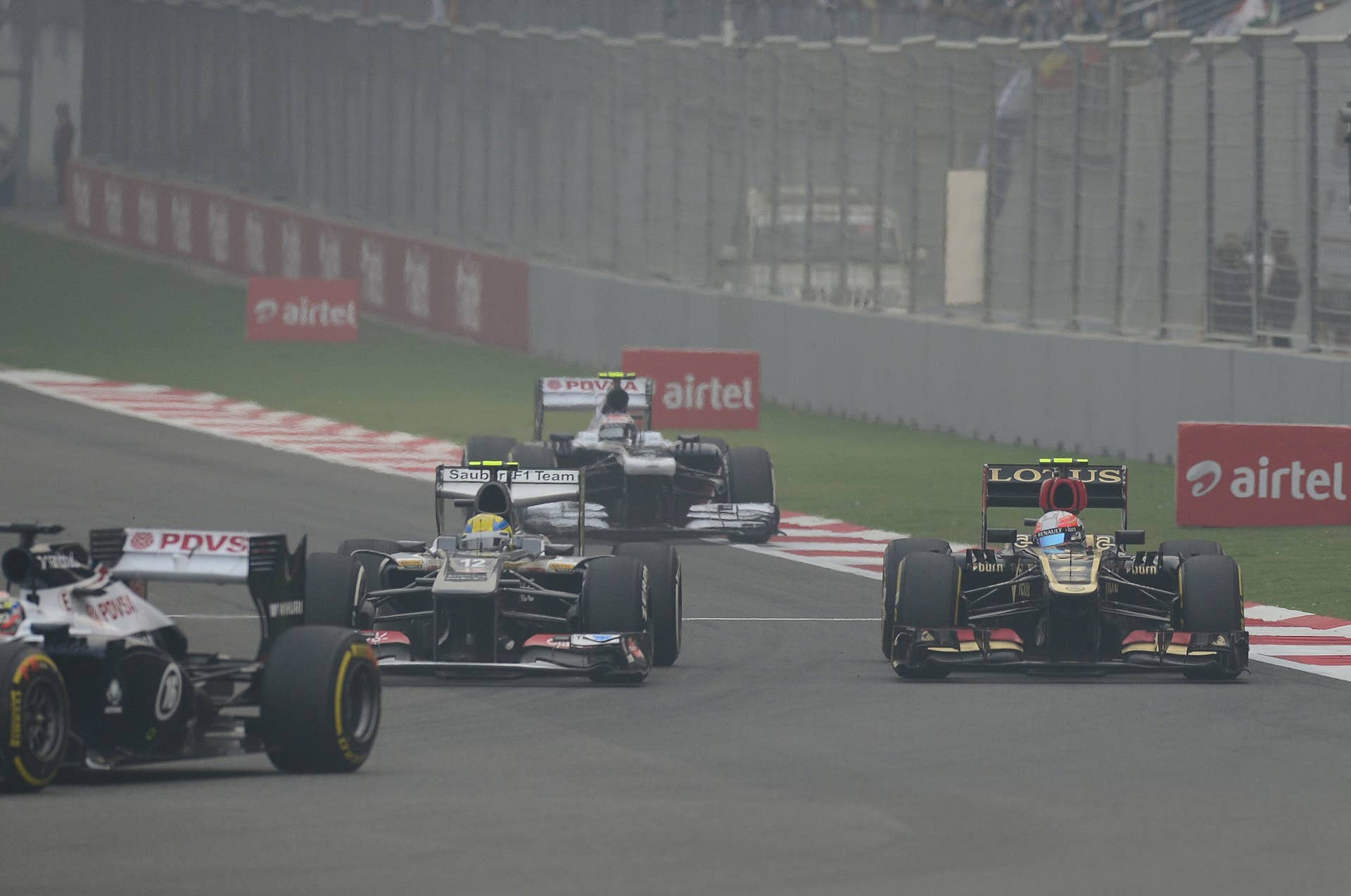 Lotus driver Romain Grosjean of France (R) drives during the Formula One Indian Grand Prix 2013 at the Buddh International circuit in Greater Noida, on the outskirts of New Delhi on October 27, 2013. AFP PHOTO/MANAN VATSYAYANA        (Photo credit should read MANAN VATSYAYANA/AFP/Getty Images)