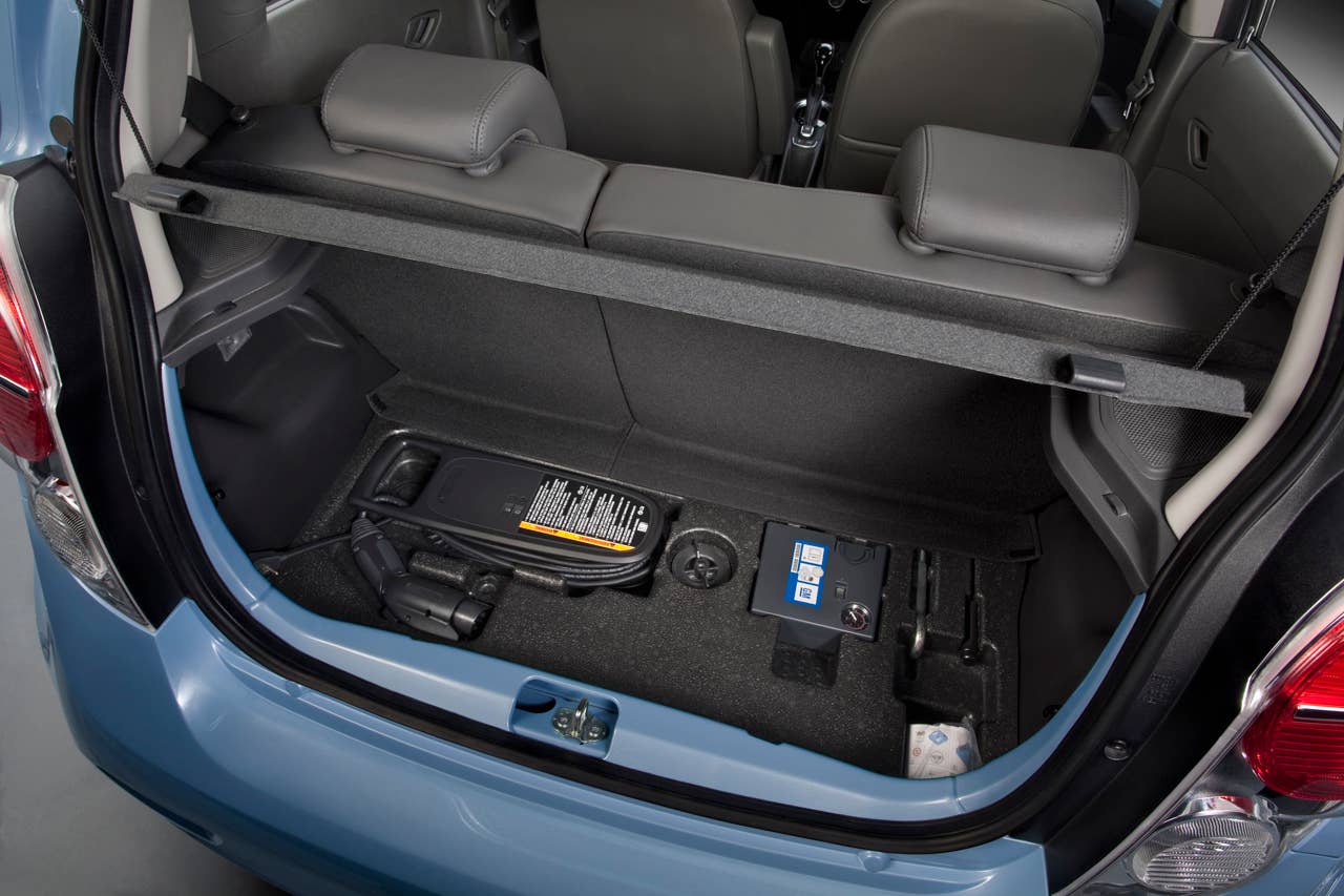 The 2014 Chevrolet Spark EV,unveiled at the 2012 Los Angles Auto Show,gives EV drivers the high tech infotainment they want- and need- to get the most out of their EV experience. With two reconfigurable, HD, seven inch color LCD screens, the Spark EV features a customizable interface with confidence gauge. Spark EV also has Chevrolets exclusive MyLink radiowhich brings smartphone-based infotainment  including apps for BringGofull-function navigation, Siri voice recognition, TuneInglobal internet radio, Pandoraand Stitcher into the vehicle. Note: All Spark EV range values represented in these photographs are for reference only and do not represent the range of the vehicle.