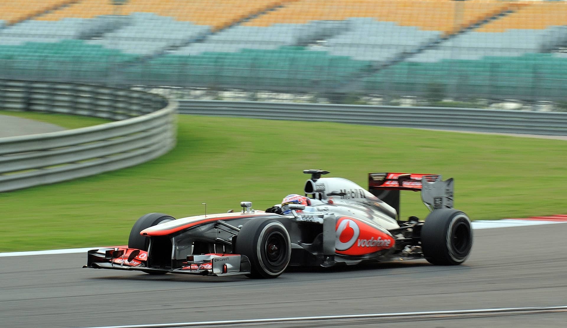 McLaren driver Jenson Button of Britain drives his car during the Formula One Indian Grand Prix 2013 at the Buddh International circuit in Greater Noida on the outskirts of New Delhi October 27, 2013. AFP PHOTO/Prakash SINGH        (Photo credit should read PRAKASH SINGH/AFP/Getty Images)