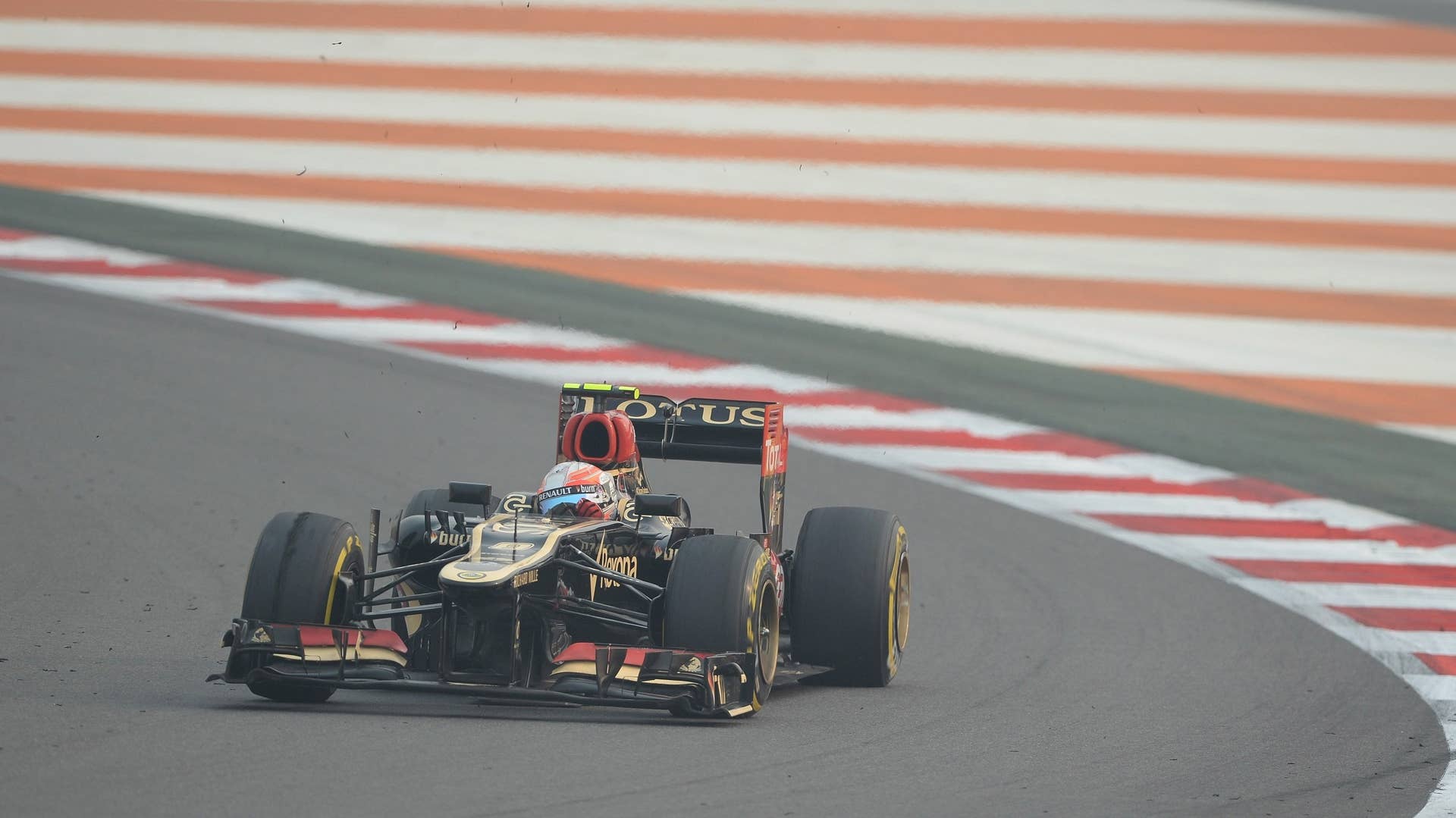 Lotus driver Romain Grosjean of France drives his car during the Formula One Indian Grand Prix 2013 at the Buddh International circuit in Greater Noida, on the outskirts of New Delhi on October 27, 2013. AFP PHOTO/ Prakash SINGH        (Photo credit should read PRAKASH SINGH/AFP/Getty Images)