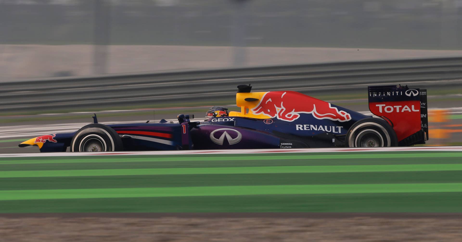 Red Bull driver Sebastian Vettel of Germany steers his car during the Indian Formula One Grand Prix at the Buddh International Circuit in Noida, India, Sunday, Oct. 27, 2013. (AP Photo/Saurabh Das)
