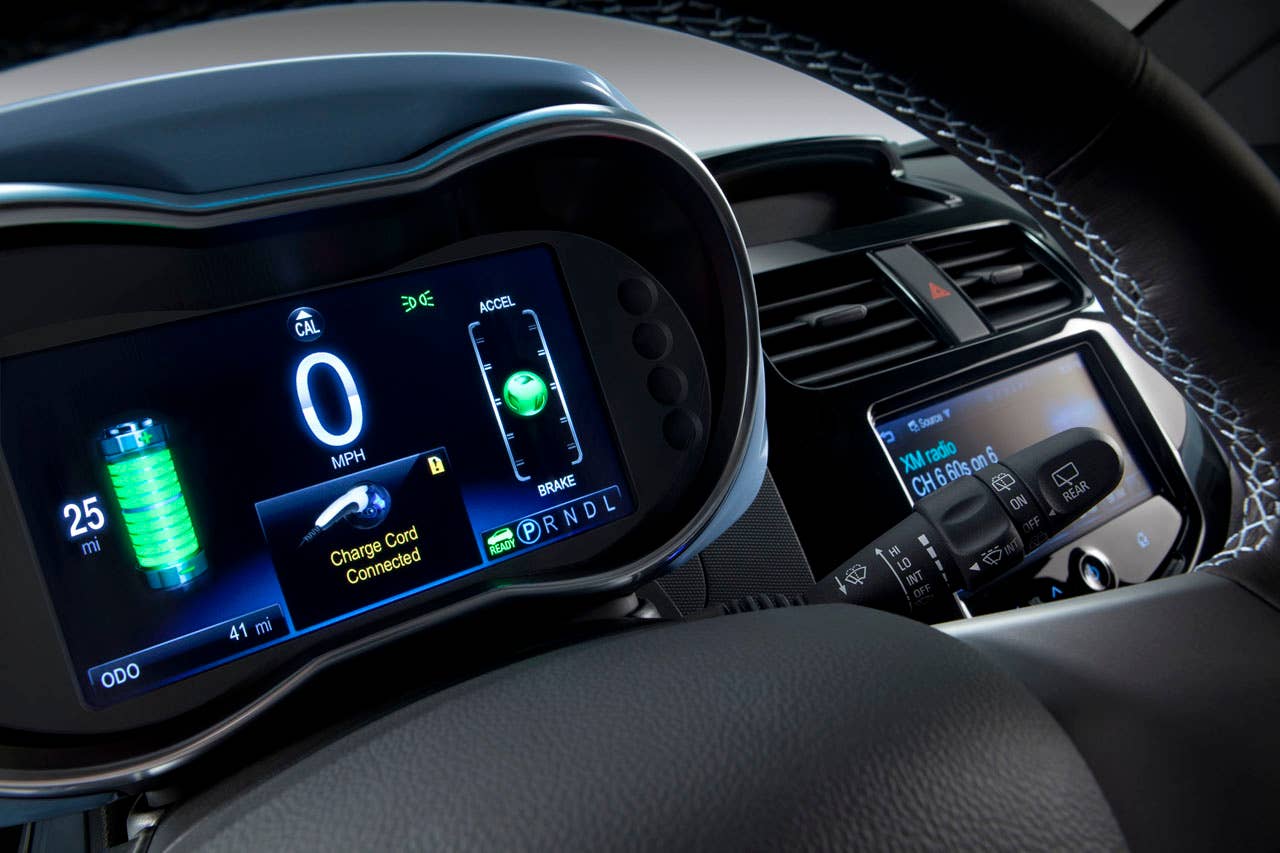 The 2014 Chevrolet Spark EV,unveiled at the 2012 Los Angles Auto Show,gives EV drivers the high tech infotainment they want- and need- to get the most out of their EV experience. With two reconfigurable, HD, seven inch color LCD screens, the Spark EV features a customizable interface with confidence gauge. Spark EV also has Chevrolets exclusive MyLink radiowhich brings smartphone-based infotainment  including apps for BringGofull-function navigation, Siri voice recognition, TuneInglobal internet radio, Pandoraand Stitcher into the vehicle. Note: All Spark EV range values represented in these photographs are for reference only and do not represent the range of the vehicle.