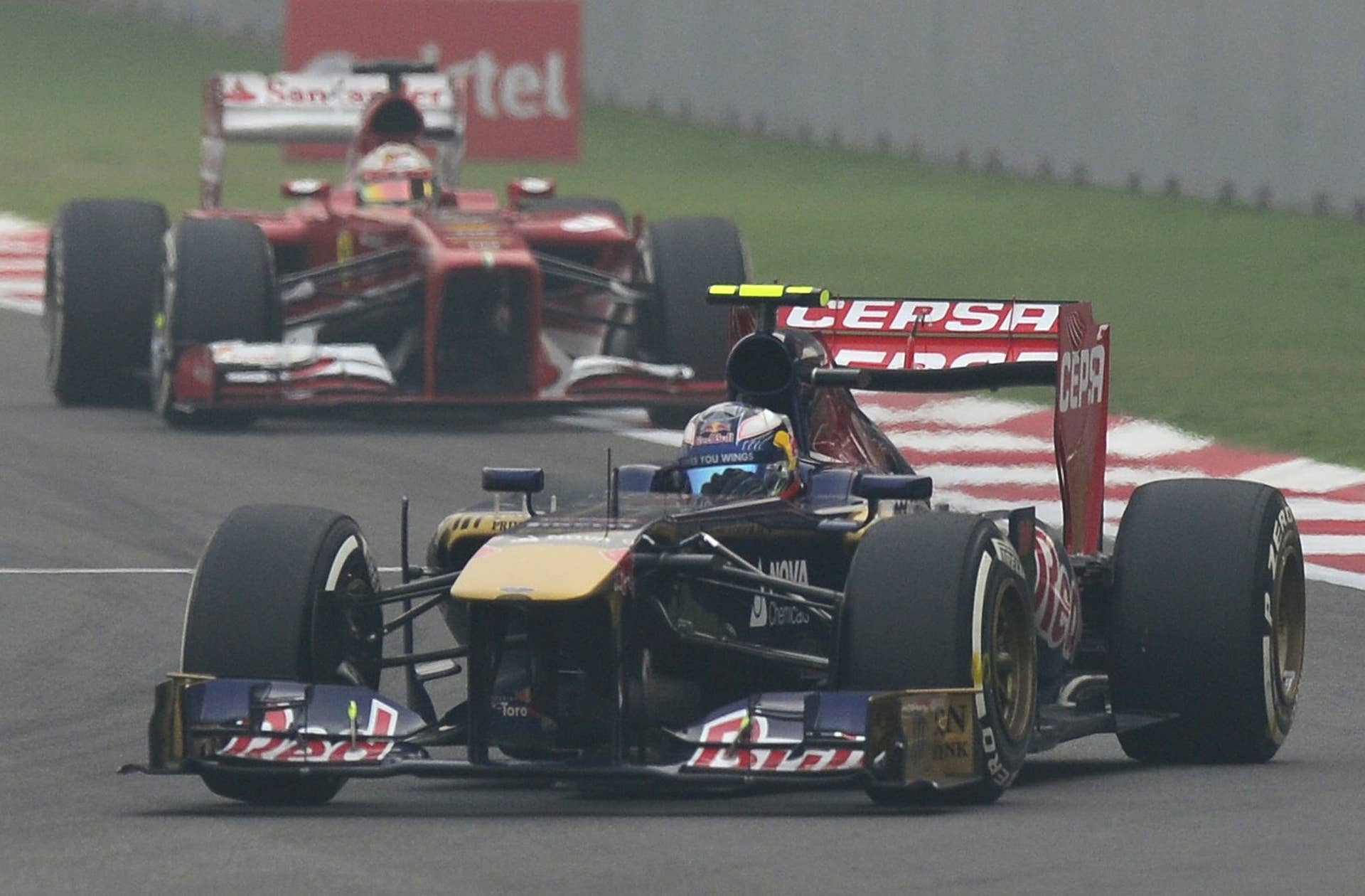 Toro Rosso driver Daniel Ricciardo of Australia drives his car during the Formula One Indian Grand Prix 2013 at the Buddh International circuit in Greater Noida, on the outskirts of New Delhi on October 27, 2013.  AFP PHOTO/ MANAN VATSYAYANA        (Photo credit should read MANAN VATSYAYANA/AFP/Getty Images)