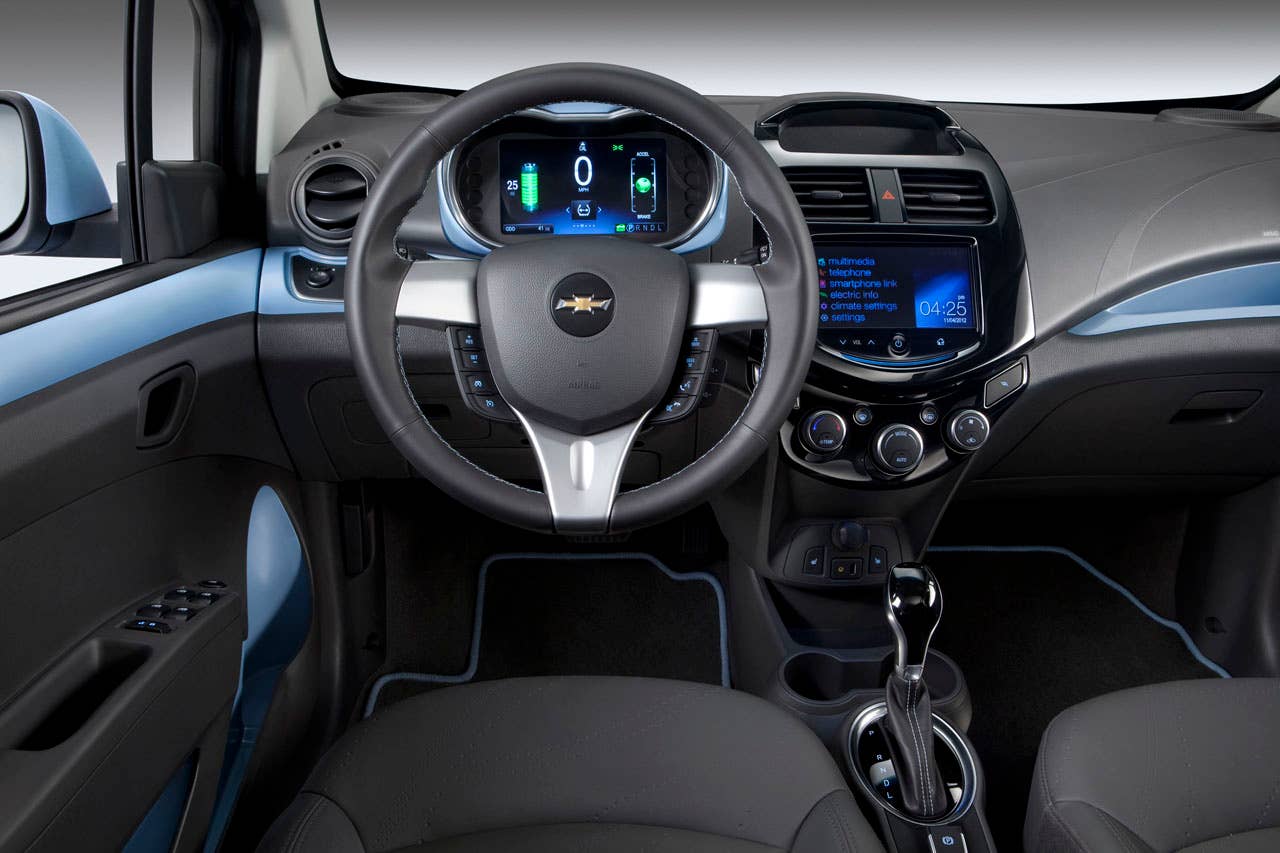The 2014 Chevrolet Spark EV,unveiled at the 2012 Los Angles Auto Show,gives EV drivers the high tech infotainment they want- and need- to get the most out of their EV experience. With two reconfigurable, HD, seven inch color LCD screens, the Spark EV features a customizable interface with confidence gauge. Spark EV also has Chevrolets exclusive MyLink radiowhich brings smartphone-based infotainment  including apps for BringGofull-function navigation, Siri voice recognition, TuneInglobal internet radio, Pandoraand Stitcher into the vehicle. Note: All Spark EV range values represented in these photographs are for reference only and do not represent the range of the vehicle.
