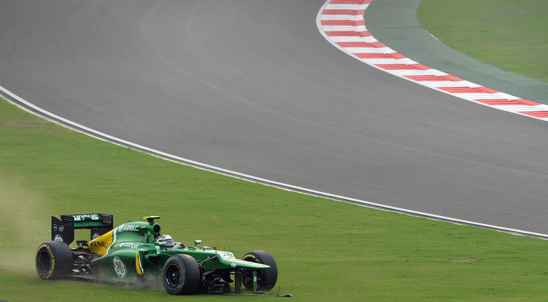 Caterham driver Giedo Van Der Garde of the Netherlands runs off the track during the Formula One Indian Grand Prix 2013 at the Buddh International circuit in Greater Noida, on the outskirts of New Delhi on October 27, 2013.   AFP PHOTO/Indranil MUKHERJEE        (Photo credit should read INDRANIL MUKHERJEE/AFP/Getty Images)