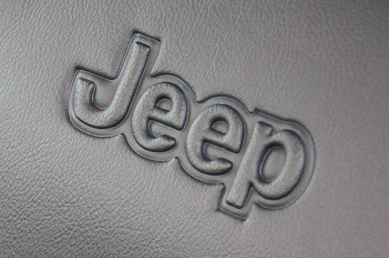2011 Jeep Compass seat logo