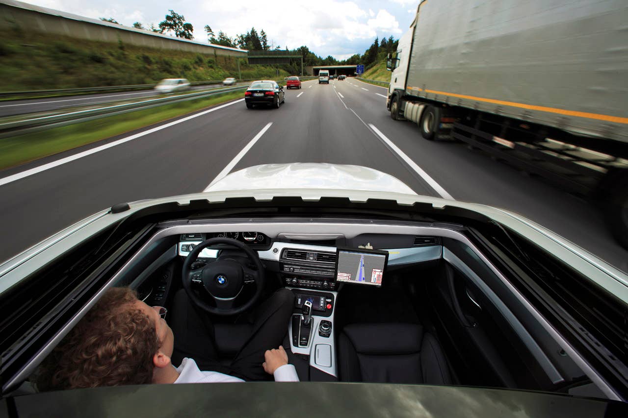 Research project Highly automated driving on highways - Dr. Nico Kmpchen on a test drive (08/2011)