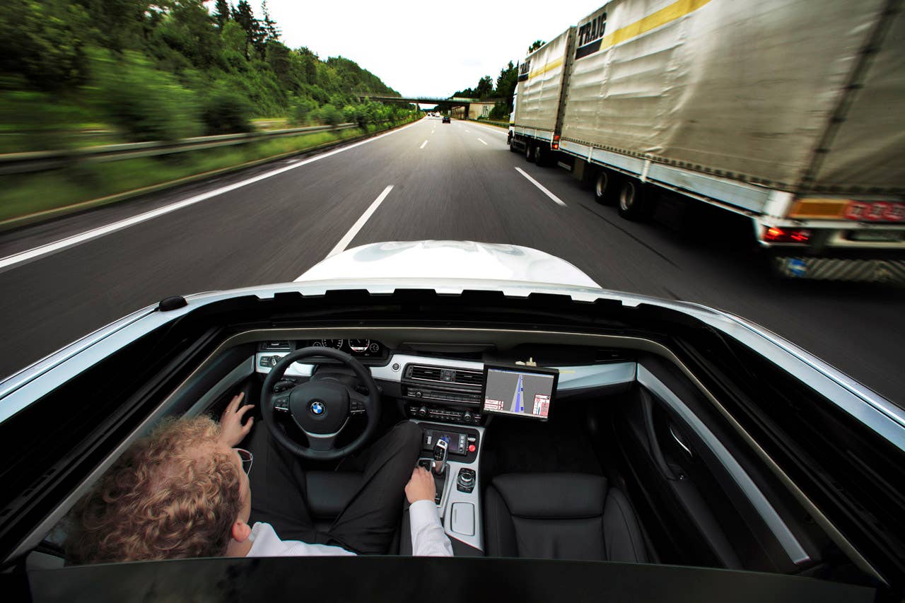 Research project Highly automated driving on highways - Dr. Nico Kmpchen on a test drive (08/2011)
