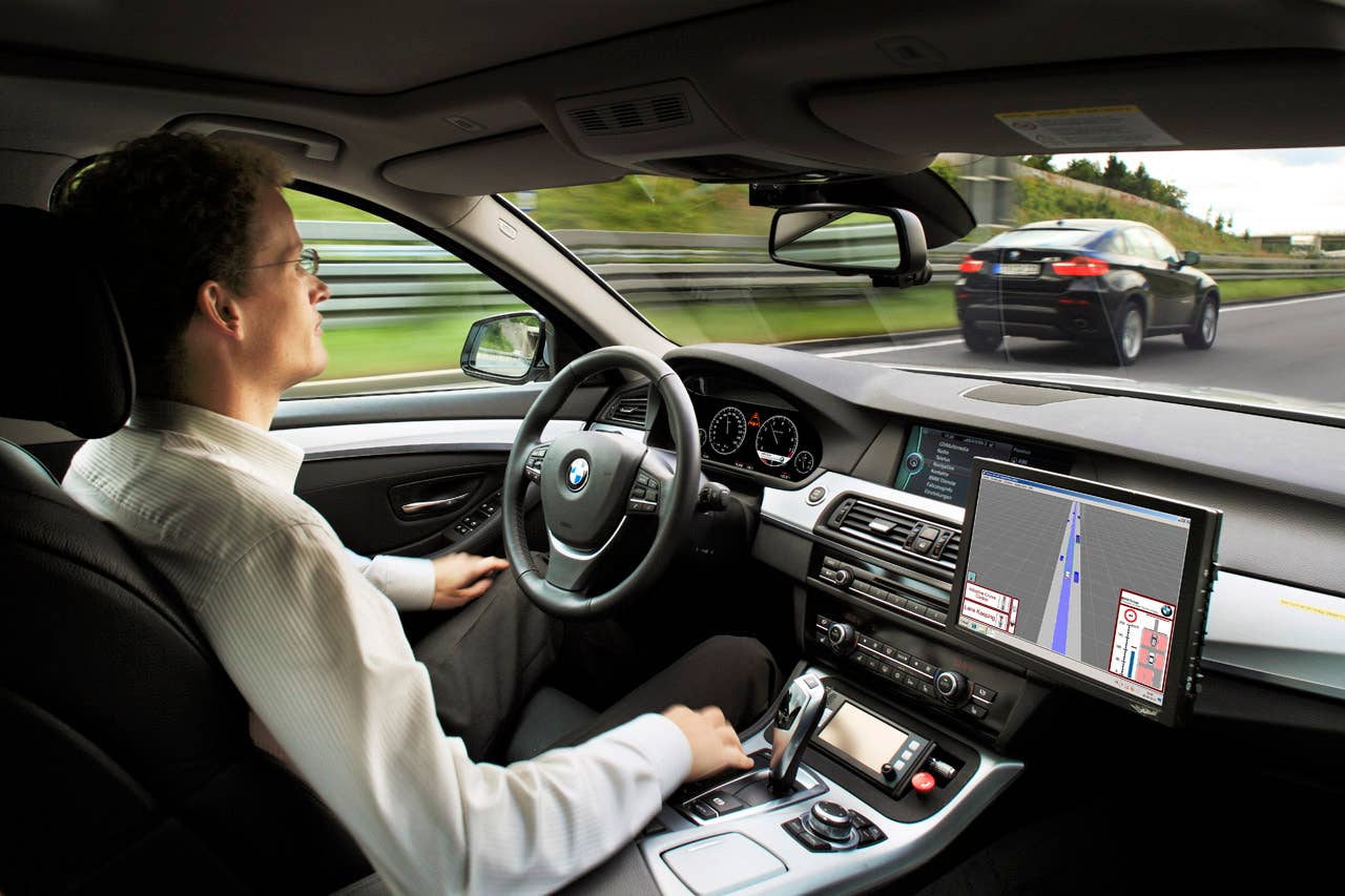 Research project Highly automated driving on highways - Dr. Nico Kmpchen on a test drive (08/2011)