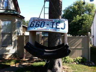 As we were leaving DesMoines and headed for Lincoln Nebraska, we got onto a secondary road of small villages and farms. Assistant Editor Colin Croughan spotted this birdhouse. I'm glad he did. It is a great example of recycling car parts into something useful. I wondered if a kid, about ten or twelve years old, put it together in his garage on a slow day--of which there are many in rural Iowa.