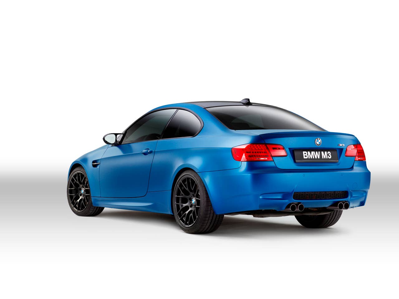 2013 BMW M3 Coupe Frozen Limited Edition rear 3/4 in blue