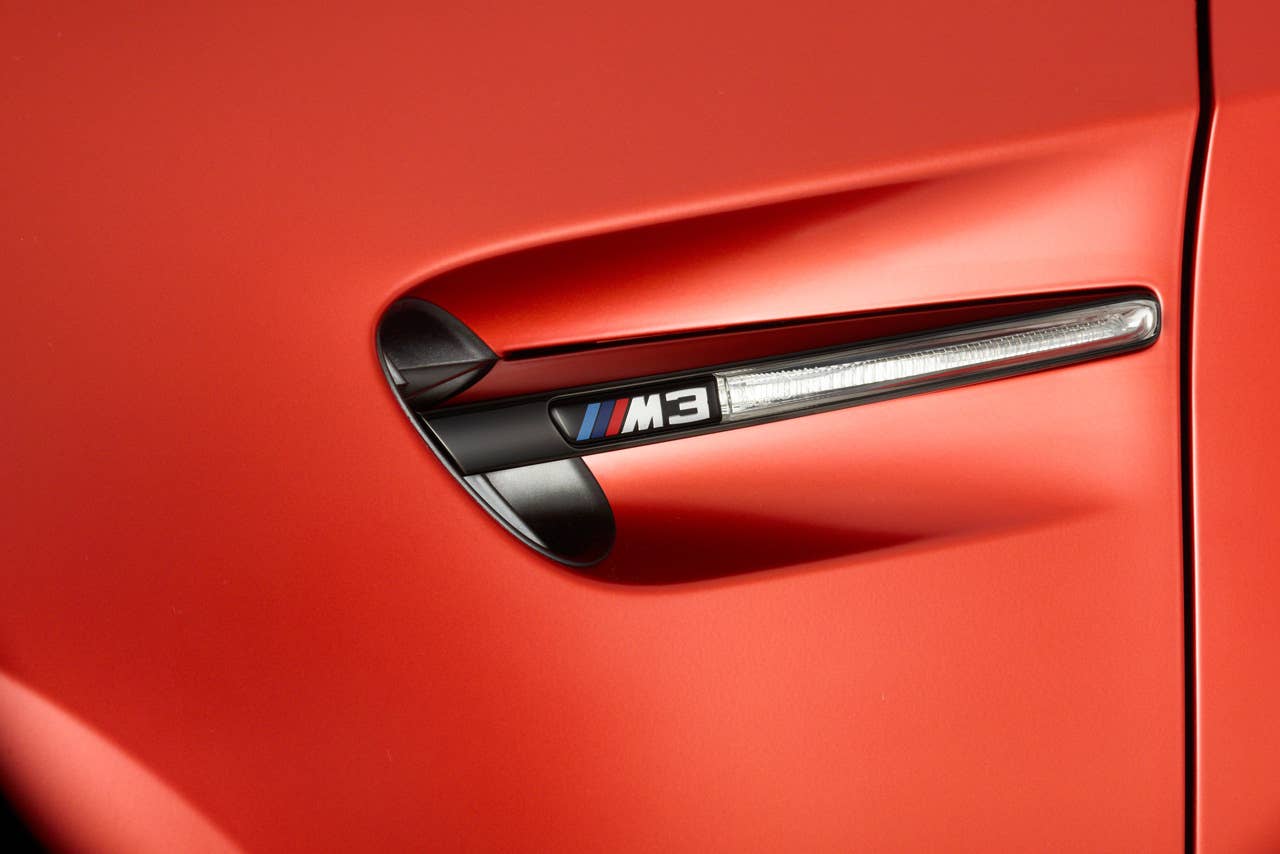 2013 BMW M3 Coupe Frozen Limited Edition fender vent detail in red