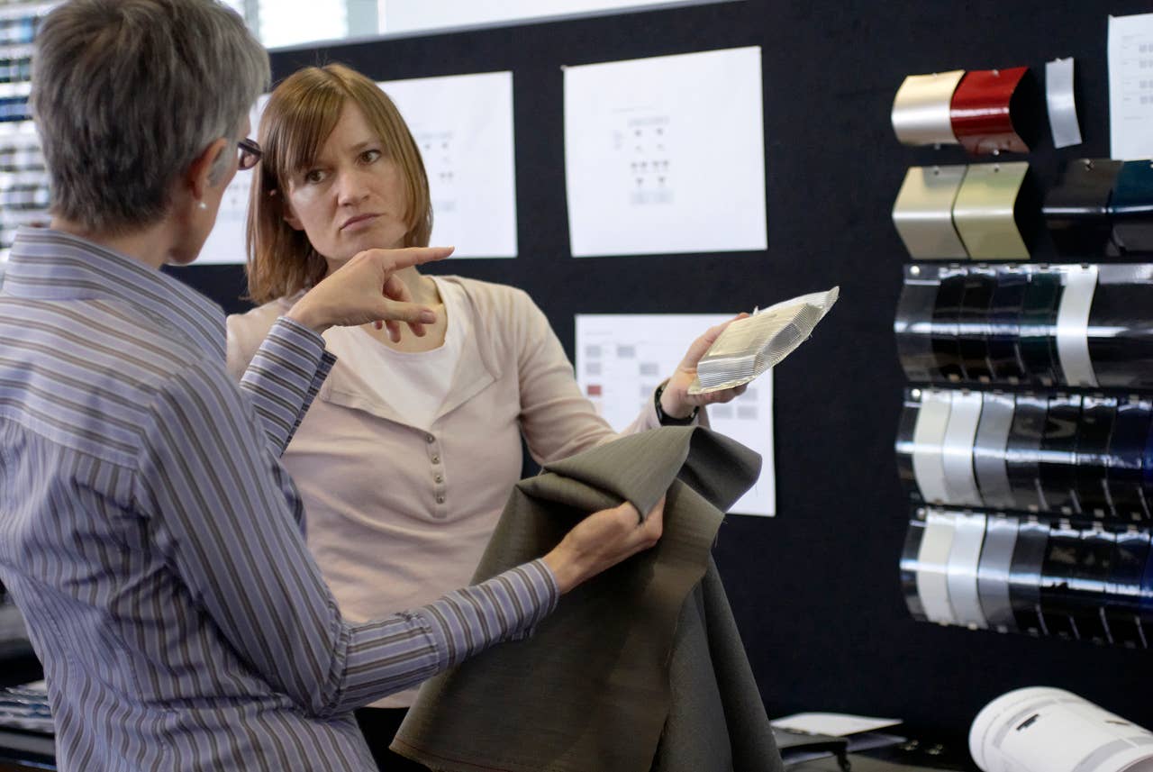Material decision - Christiane Schneider (Colour and Trim Designer on the right) and Maria Boewingloh (Colour and Trim Designer on the left) choosing the materials for the BMW 6 Series Coupe (03/2011).
