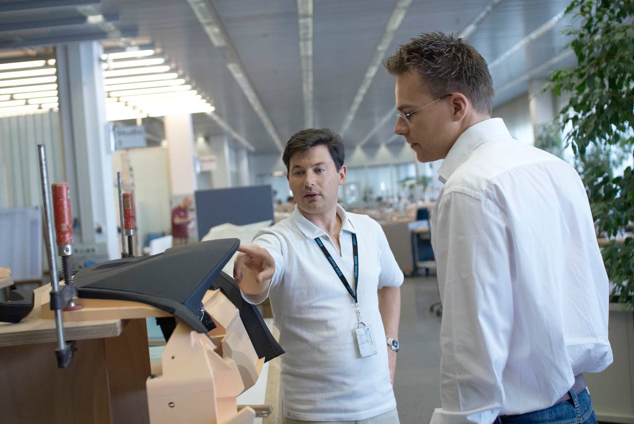 Geometrie in detail: Marc Girard (Head of Interior Design BMW Automobiles, on the left) discussing with Christian Bauer (Interior Designer BMW 6 Series Coupe, on the right) parts of the dashboard (03/2011).