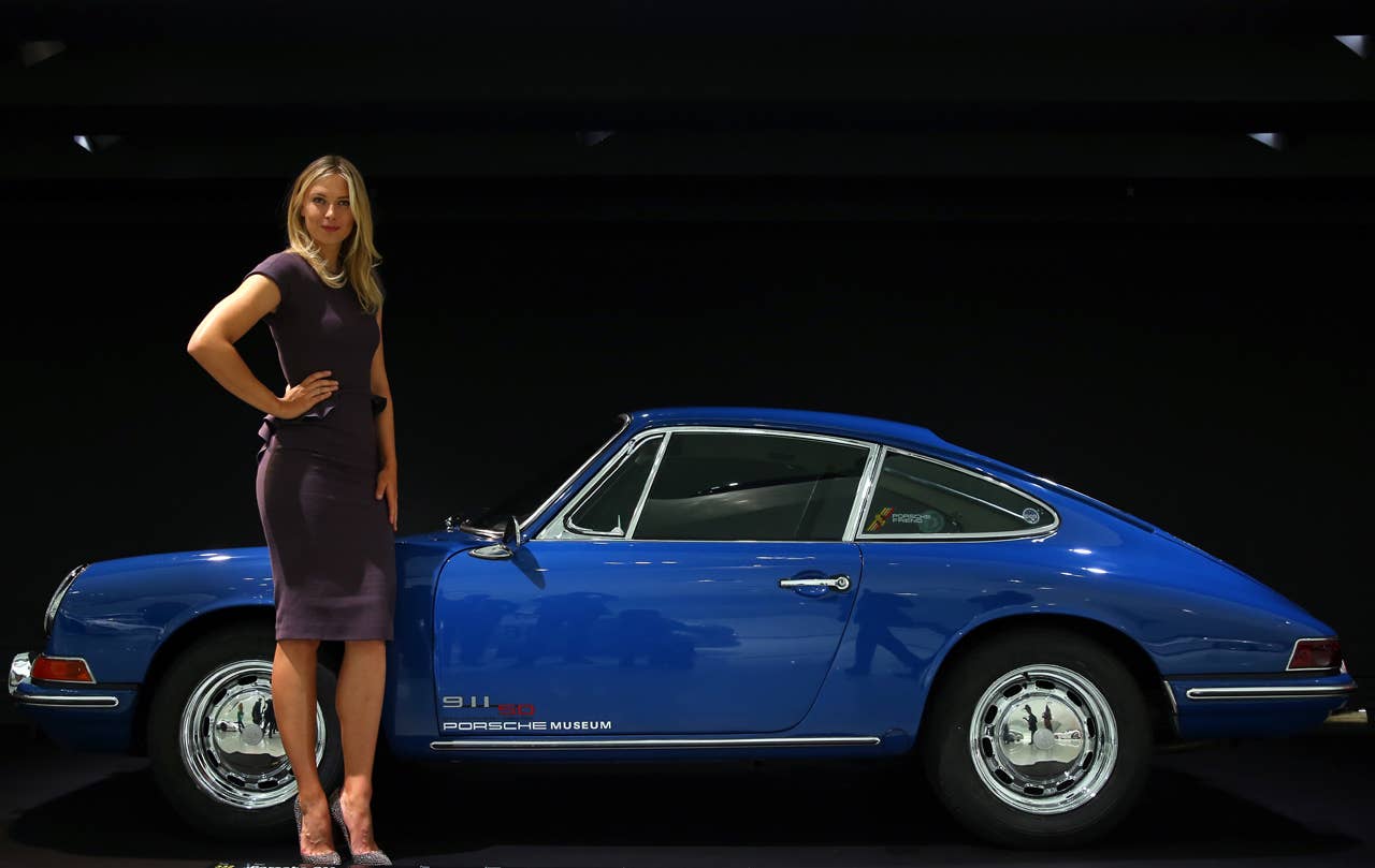 STUTTGART, GERMANY - APRIL 22:  Tennis player Maria Sharapova poses next to a Porsche 911 2.0 Coupe at the Porsche Museum on April 22, 2013 in Stuttgart, Germany.  (Photo by Alexander Hassenstein/Bongarts/Getty Images)