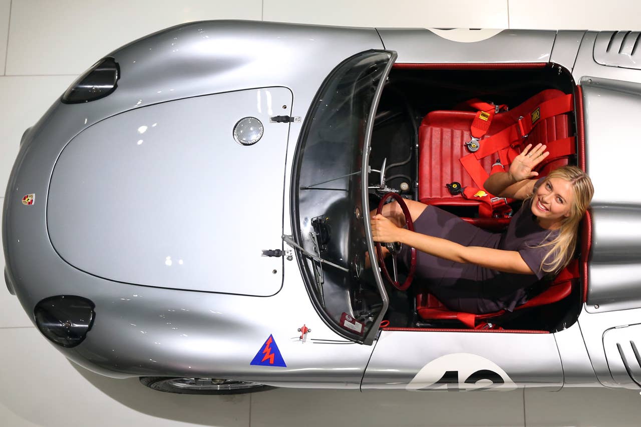 STUTTGART, GERMANY - APRIL 22:  Tennis player Maria Sharapova poses in a Porsche 718  RS 60 Spyder at the Porsche Museum on April 22, 2013 in Stuttgart, Germany.  (Photo by Alexander Hassenstein/Bongarts/Getty Images)