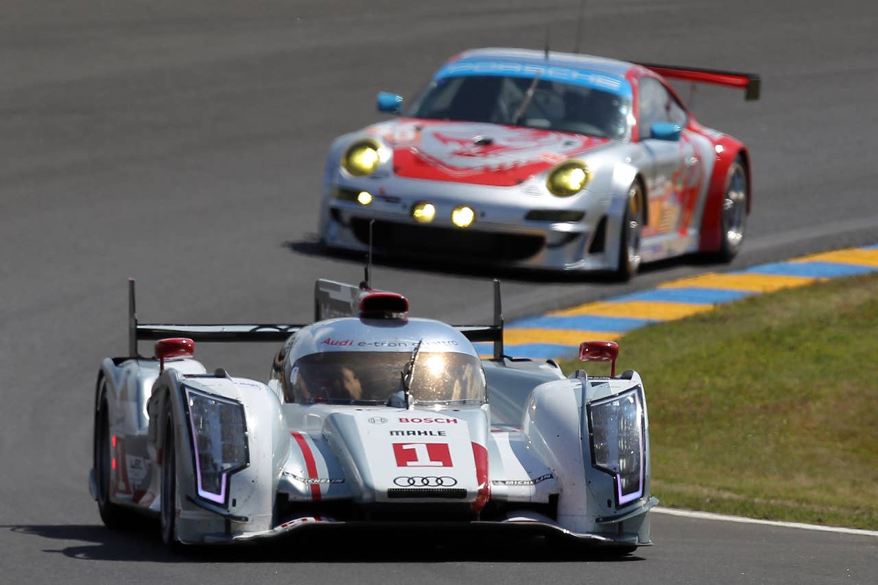 The Audi R18 E-Tron driven by Andre Lotterer of Germany, Marcel Fassler of Switzerland and Benoit Treluyer of France is seen in action during the free practice session of the 80th 24-hour Le Mans endurance race, in Le Mans, western France, Wednesday, June 13, 2012. The race will begin on Saturday, June 16. (AP Photo/David Vincent)