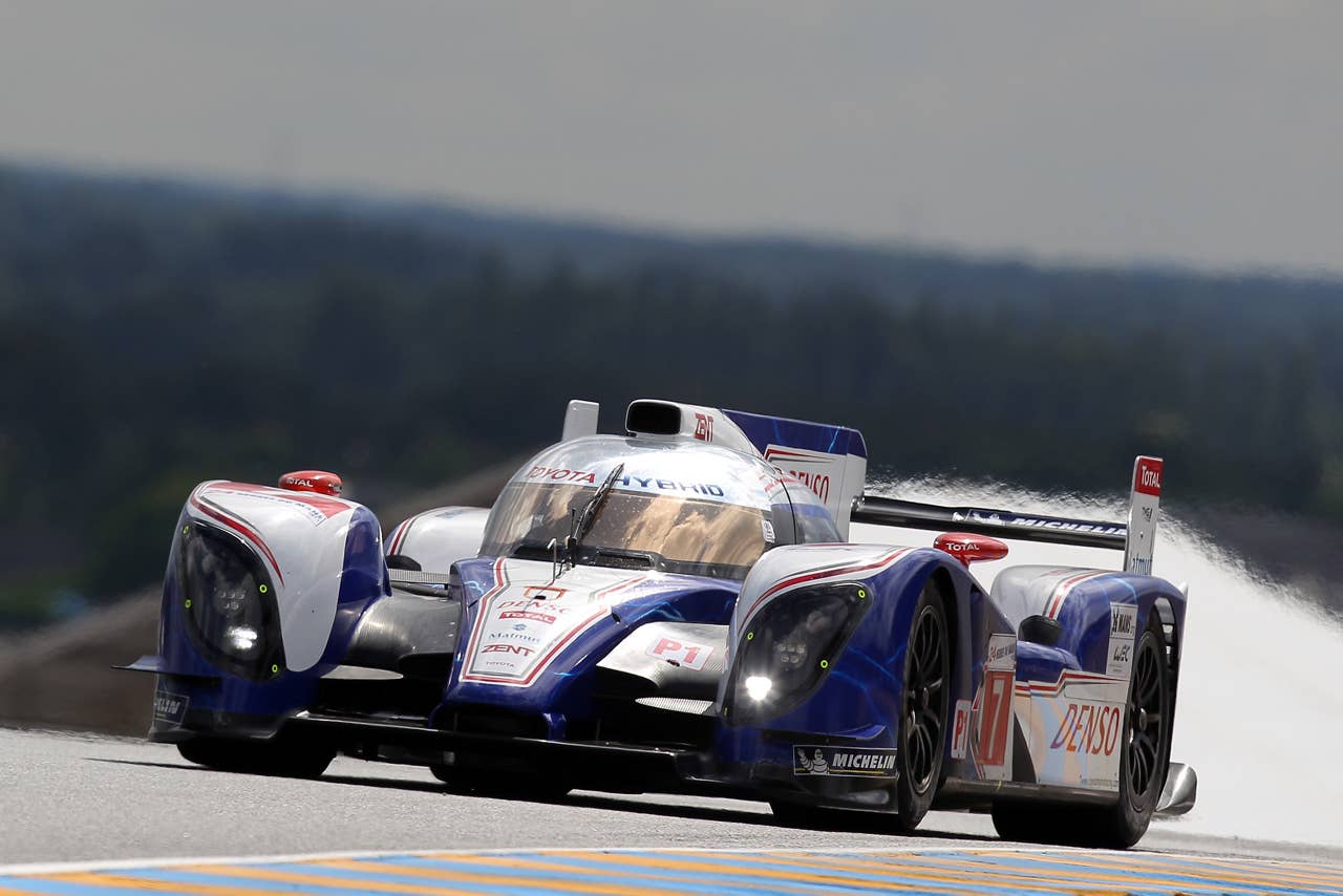 The Toyota TS 030 Hybrid  driven by Alexander Wurz of Austria, Nicolas Lapierre of France and Kazuki Nakajima of Japan is seen in action during the free practice session of the 80th 24-hour Le Mans endurance race, in Le Mans, western France, Wednesday, June 13, 2012. The race will begin on Saturday, June 16. (AP Photo/David Vincent)