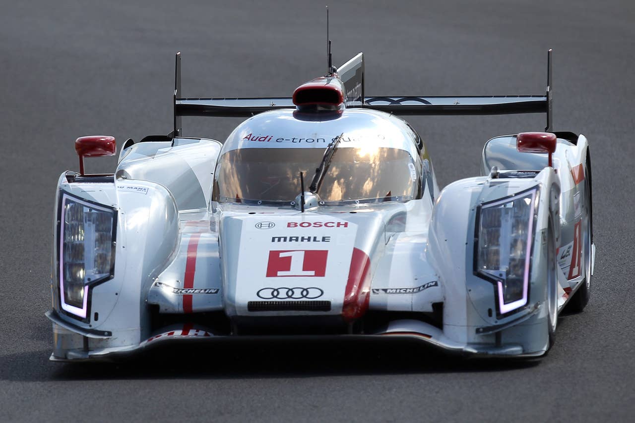 The Audi R18 E-Tron driven by Andre Lotterer of Germany, Marcel Fassler of Switzerland and Benoit Treluyer of France is seen in action during the free practice session of the 80th 24-hour Le Mans endurance race, in Le Mans, western France, Wednesday, June 13, 2012. The race will begin on Saturday, June 16. (AP Photo/David Vincent)