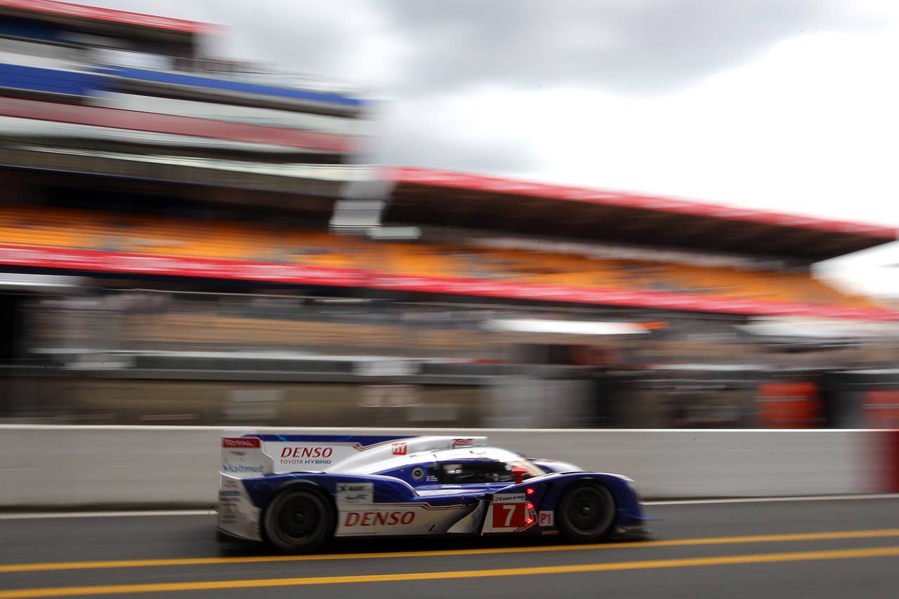 The Toyota TS 030 Hybrid driven by Alexander Wurz of Austria, Nicolas Lapierre of France and Kazuki Nakajima of Japan powers in the pit lane during the free practice session of the 80th 24-hour Le Mans endurance race, in Le Mans, western France, Wednesday, June 13, 2012. The race will begin on Saturday, June 16. (AP Photo/David Vincent)
