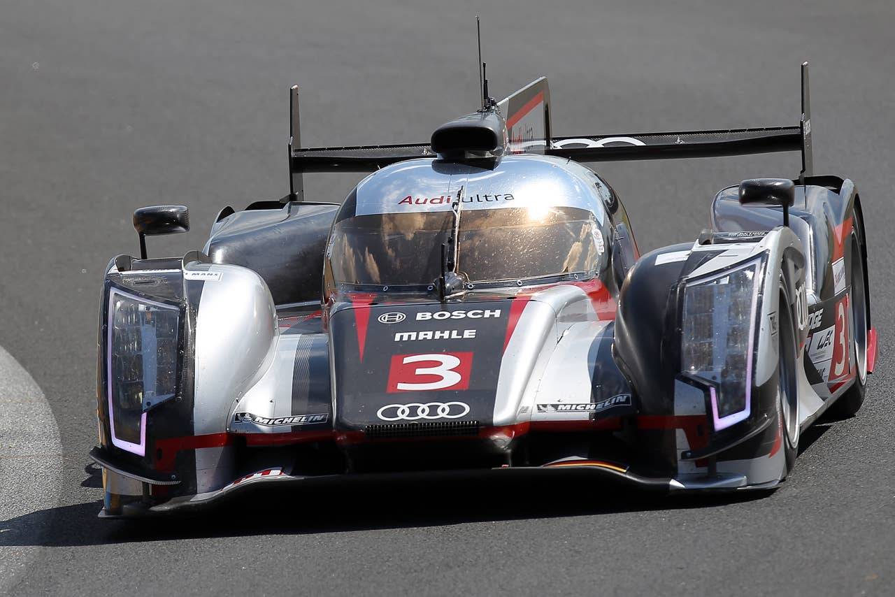 The Audi R18 Ultra driven by Marc Gene of Spain, Romain Dumas and Loic Duval both of France is seen in action during the free practice session of the 80th 24-hour Le Mans endurance race, in Le Mans, western France, Wednesday, June 13, 2012. The race will begin on Saturday, June 16. (AP Photo/David Vincent)