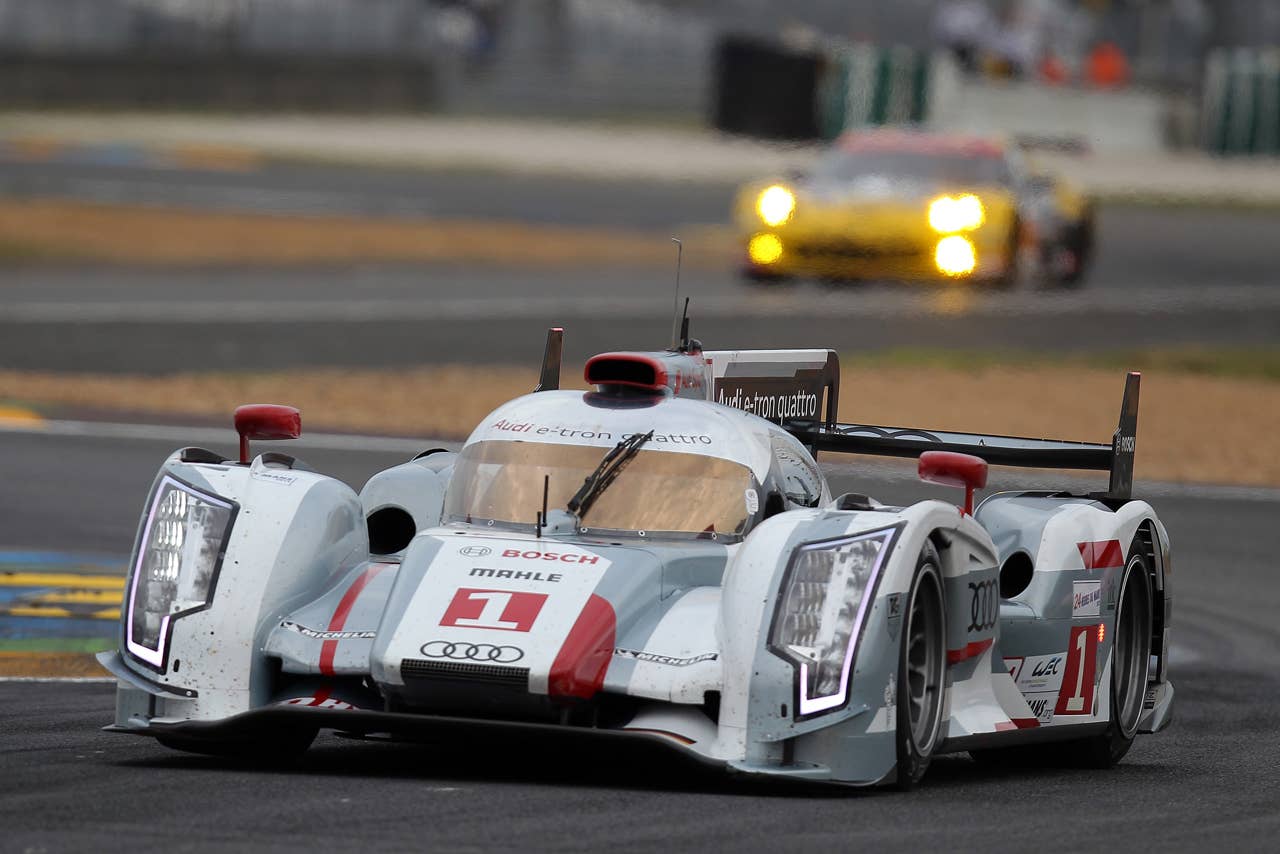 The Audi R18 E-Tron n1 driven by Andre Lotterer of Germany, Marcel Fassler of Switzerland and Benoit Treluyer of France powers in a curve during the qualifying practice session of the 80th 24-hour Le Mans endurance race, in Le Mans, western France, Thursday, June 14, 2012. The race will begin on Saturday, June 16. (AP Photo/David Vincent)
