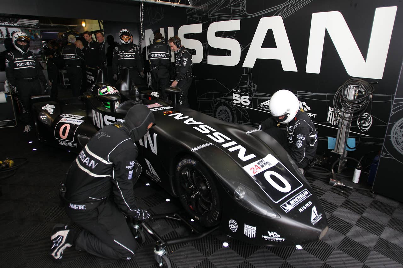 The Delta Wing Nissan driven by Marino Franchitti ofBritain, Mickael Krumm of Germnay and Satoshi Motoyama of Japan  in the pits during the free practice session of the 80th 24-hour Le Mans endurance race, in Le Mans, western France, Wednesday, June 13, 2012. The race will begin on Saturday, June 16. (AP Photo/David Vincent)