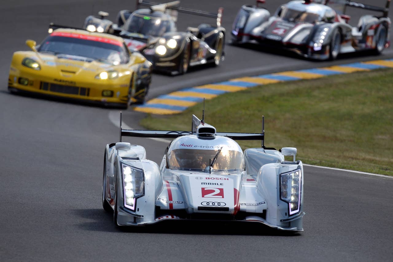 The Audi R18 E-Tron  driven by Allan McNish of Scotland, Rinaldo Capello of Italy and Tom Kristensen of Denmark leads the pack during  the free practice session of the 80th 24-hour Le Mans endurance race, in Le Mans, western France, Wednesday, June 13, 2012. The race will begin on Saturday, June 16. (AP Photo/David Vincent)