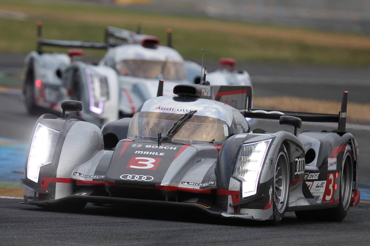 The Audi R18 Ultra n3 driven by Marc Gene of Spain, Romain Dumas and Loic Duval both of France powers in a curve during the qualifying practice session of the 80th 24-hour Le Mans endurance race, in Le Mans, western France, Thursday, June 14, 2012. The race will begin on Saturday, June 16. (AP Photo/David Vincent)