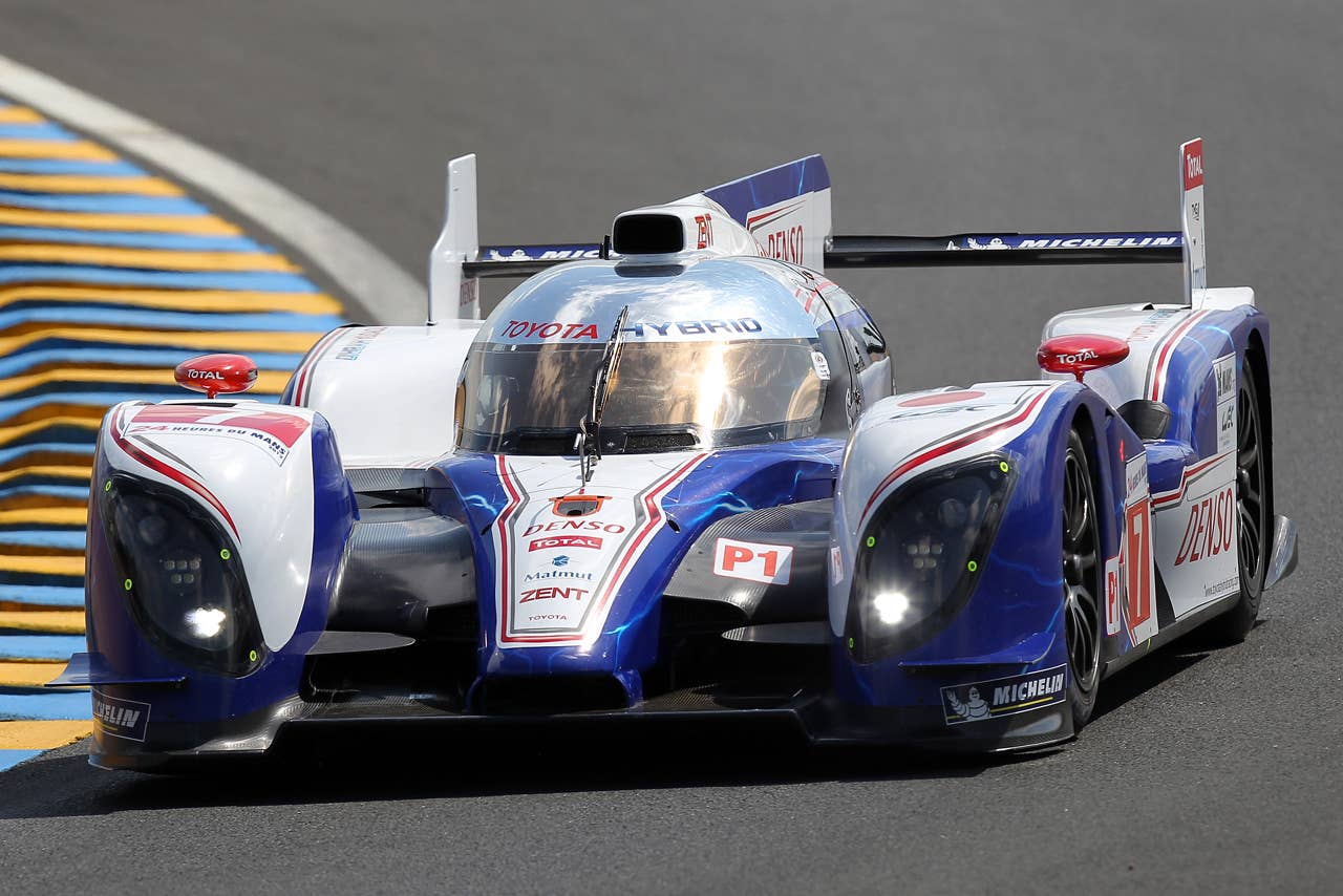 The Toyota TS 030 Hybrid  driven by Alexander Wurz of Austria, Nicolas Lapierre of France and Kazuki Nakajima of Japan is seen in action during the free practice session of the 80th 24-hour Le Mans endurance race, in Le Mans, western France, Wednesday, June 13, 2012. The race will begin on Saturday, June 16. (AP Photo/David Vincent)