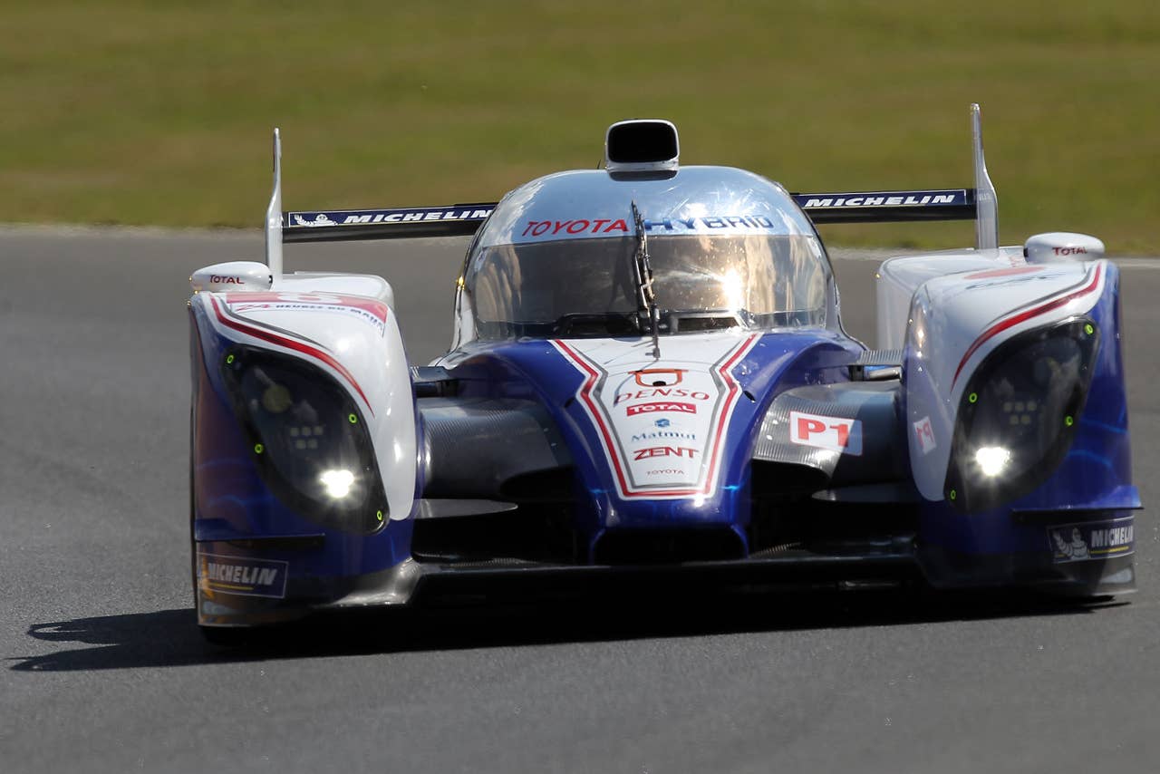 The Toyota Hybrid  driven by Antony Davidson of  Britain, Sebastien Buemi of Switzerland and Stephane Sarrazin of France is seen in action during the free practice session of the 80th 24-hour Le Mans endurance race, in Le Mans, western France, Wednesday, June 13, 2012. The race will begin on Saturday, June 16. (AP Photo/David Vincent)