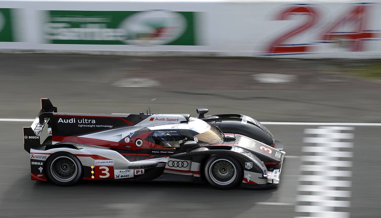 LE MANS, FRANCE - JUNE 13:  The #3 Audi R18 ultra driven by Marc Gene of Spain, Romain Dumas of France, and Loic Duval of France during practice  for the 80th running of the Le Mans 24 Hour race at the Circuit des 24 Heures du Mans  on June 13, 2012 in Le Mans, France  (Photo by Rick Dole/Getty Images)