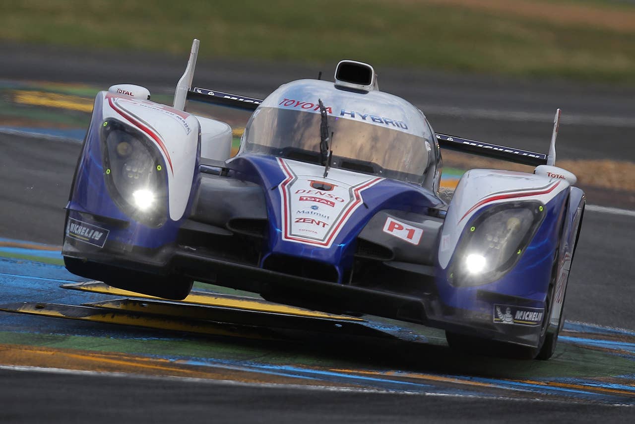 The Toyota TS030 Hybrid n8 driven by Antony Davidson of Britain, Sebastien Buemi of Switzerland and Stephane Sarrazin of France is seen in action during the qualifying practice session of the 80th 24-hour Le Mans endurance race, in Le Mans, western France, Thursday, June 14, 2012. The race will begin on Saturday, June 16. (AP Photo/David Vincent)