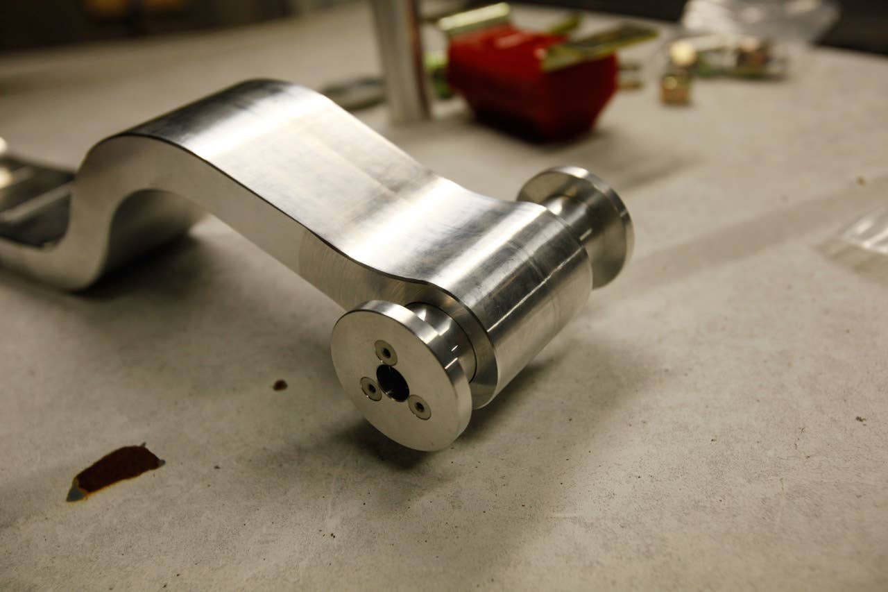 Each solid bushing is comprised of two end plates, a center sleeve and six machine screws.