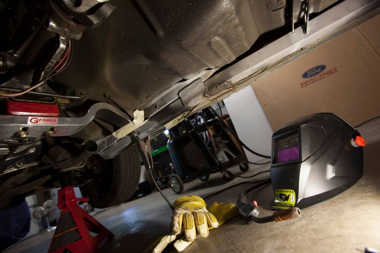 Partially installed Maximum Motorsports subframe connector.